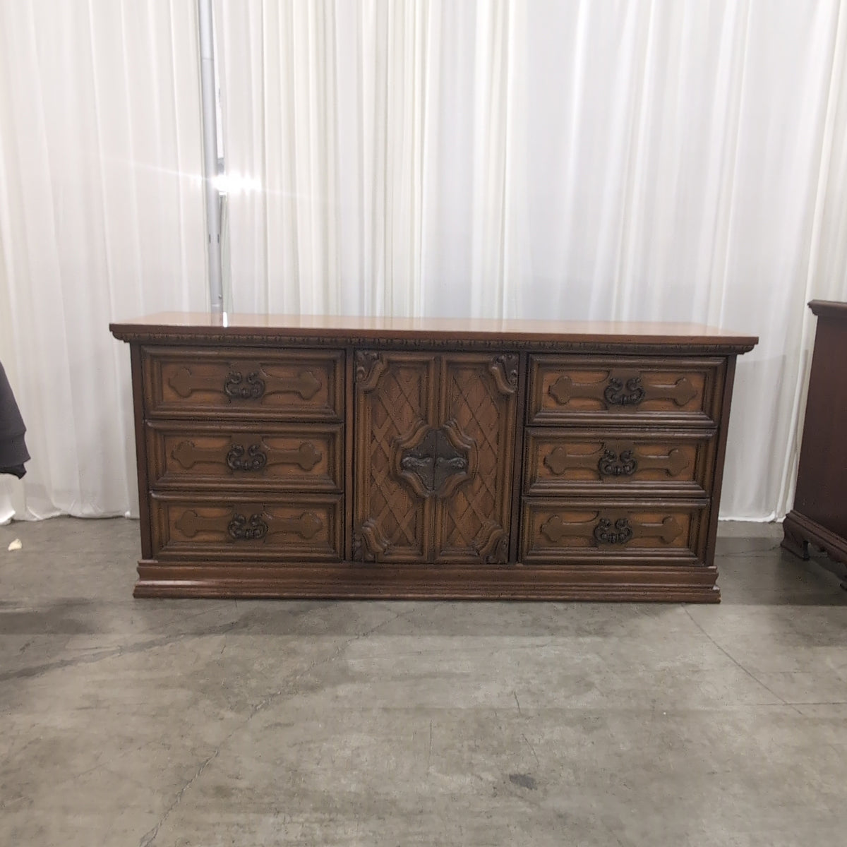 Traditional Brown Wood Dresser with Ornate Hardware
