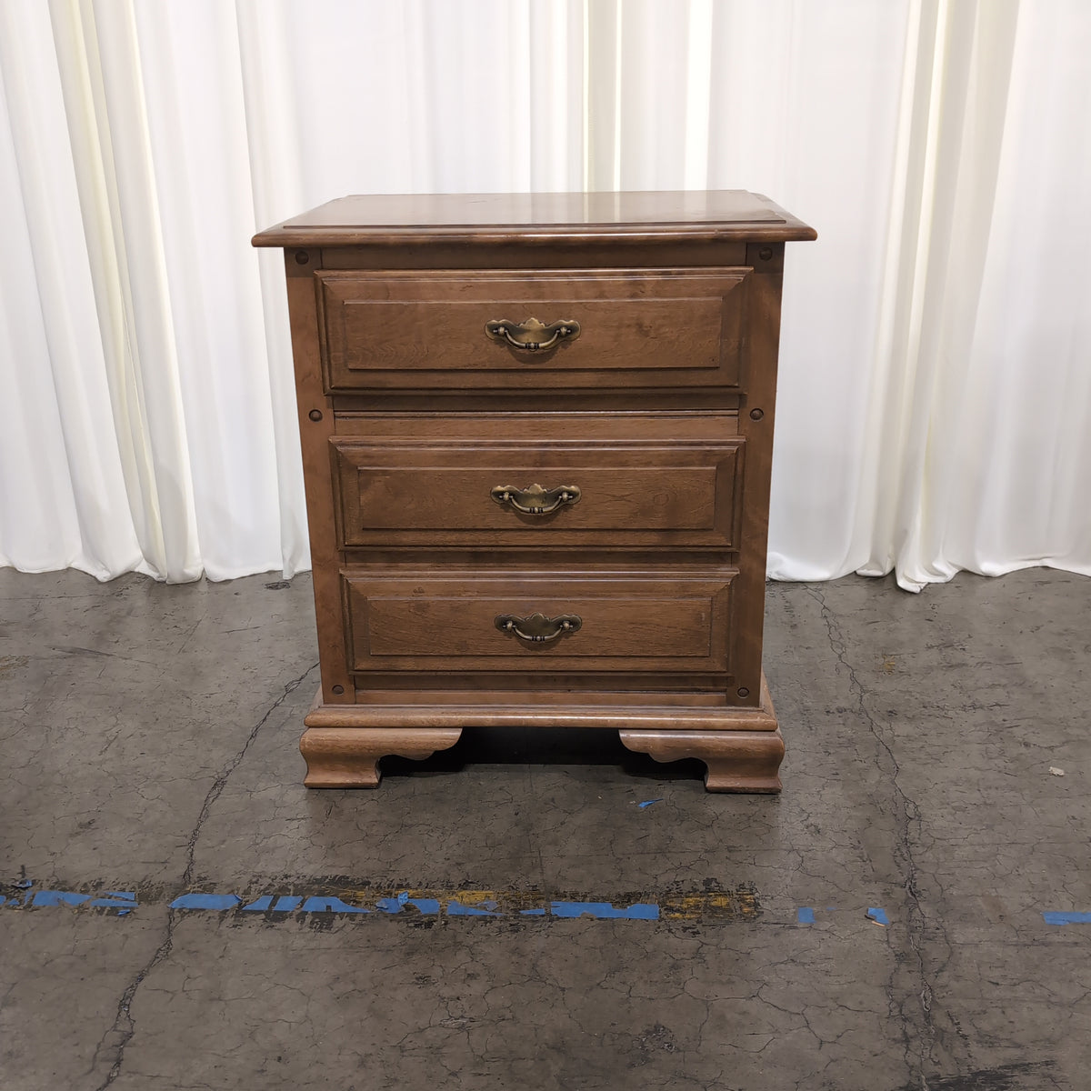 Traditional Brown Wood Nightstand with Three Drawers