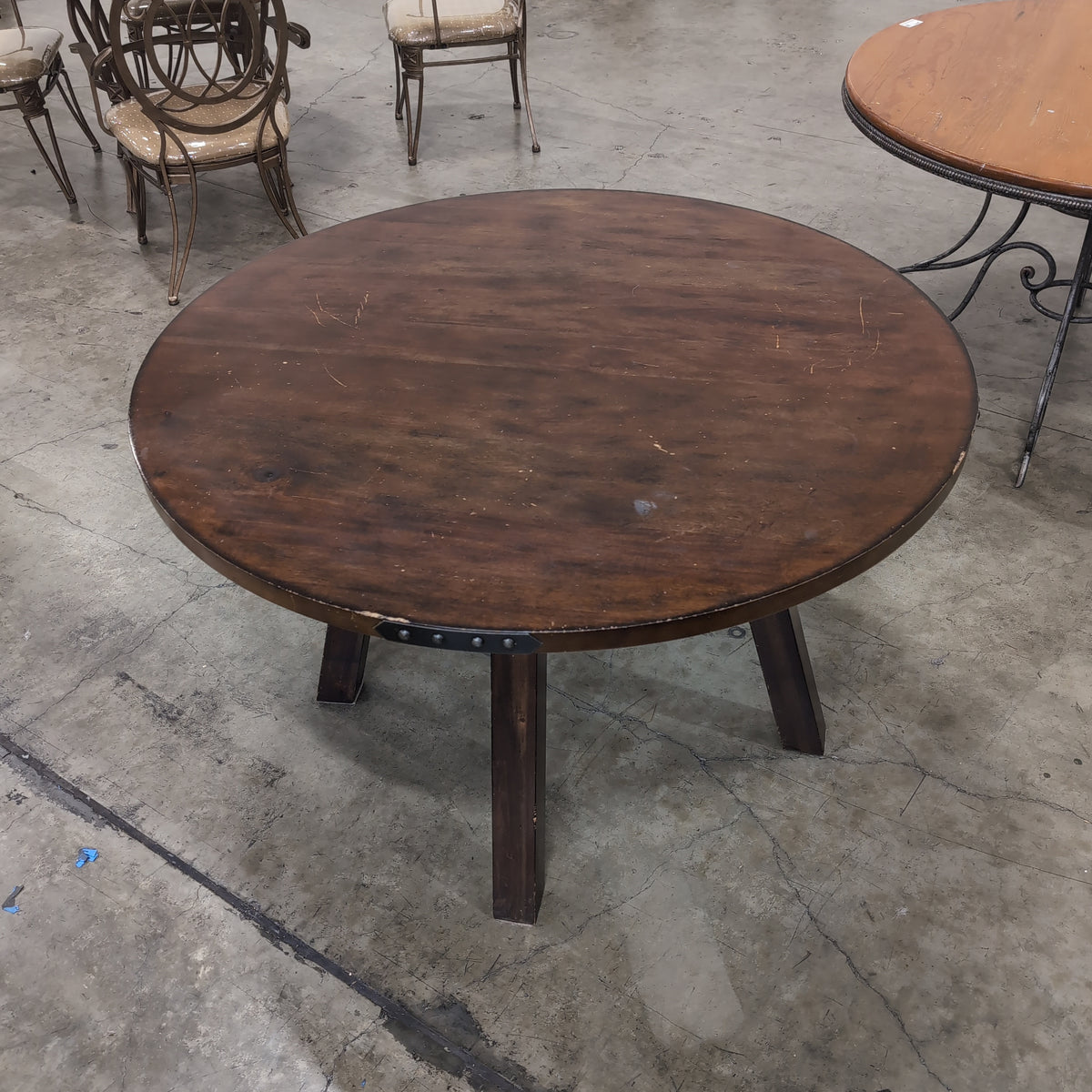 Rustic Dark Wood Round Dining Table with Metal Accents