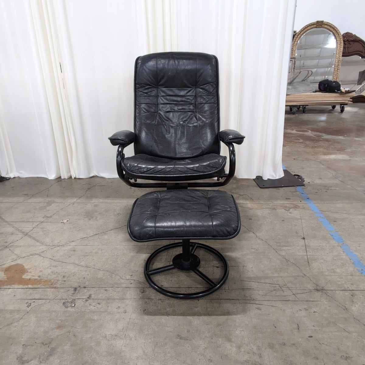 Black Tufted Leather Swivel Recliner with Ottoman