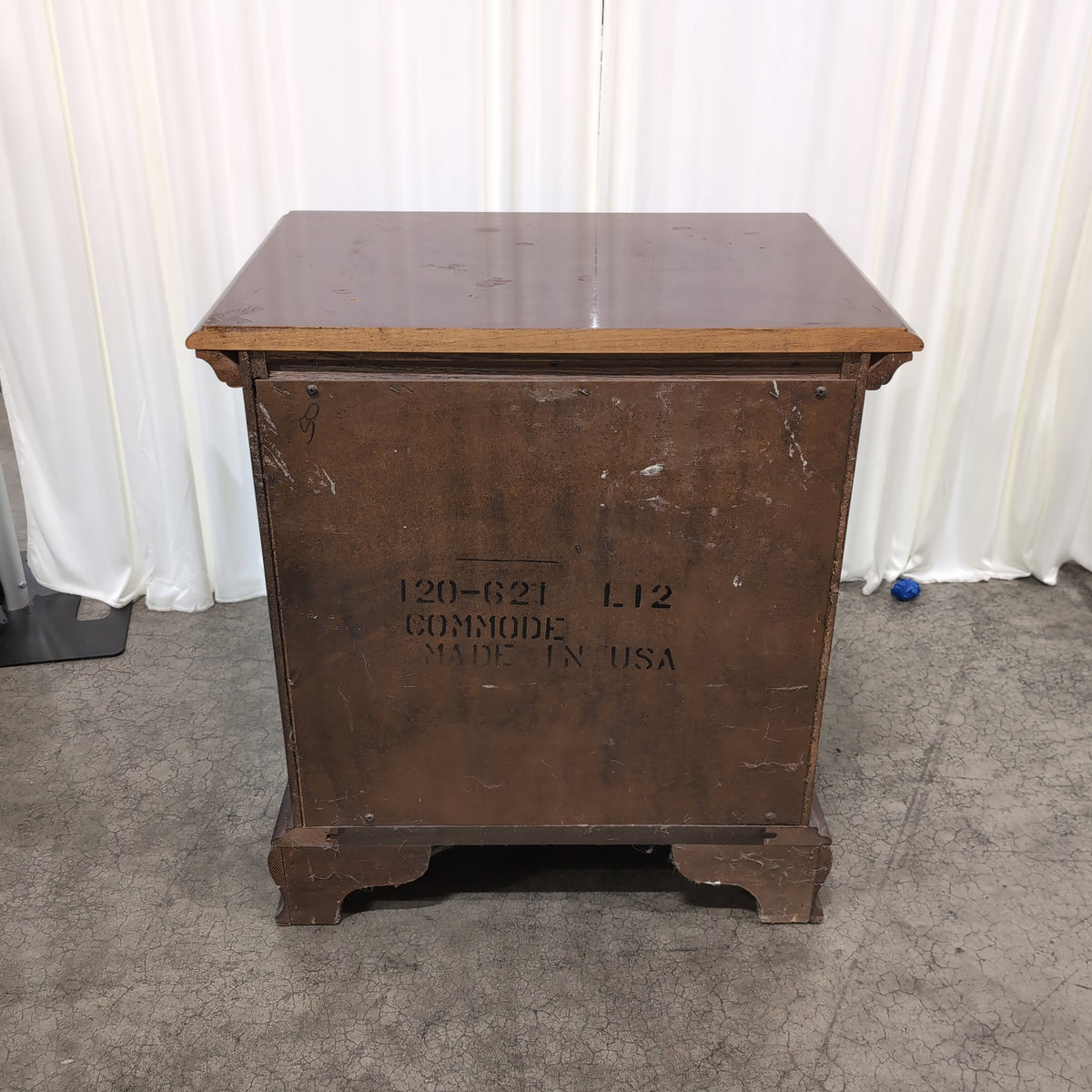 Dark Cherry Wood Nightstand with Ornate Hardware