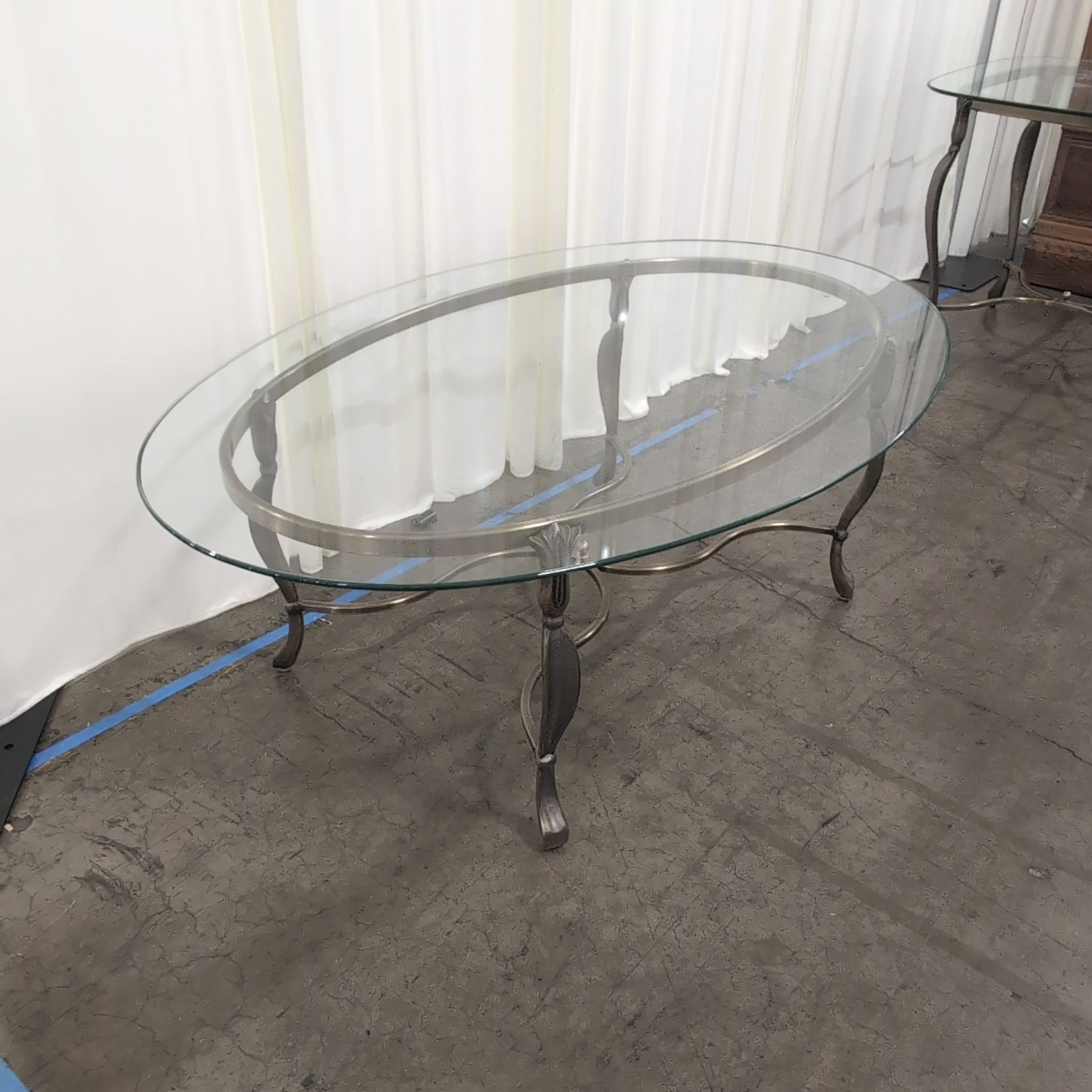 Oval Glass Coffee Table with Ornate Metal Base