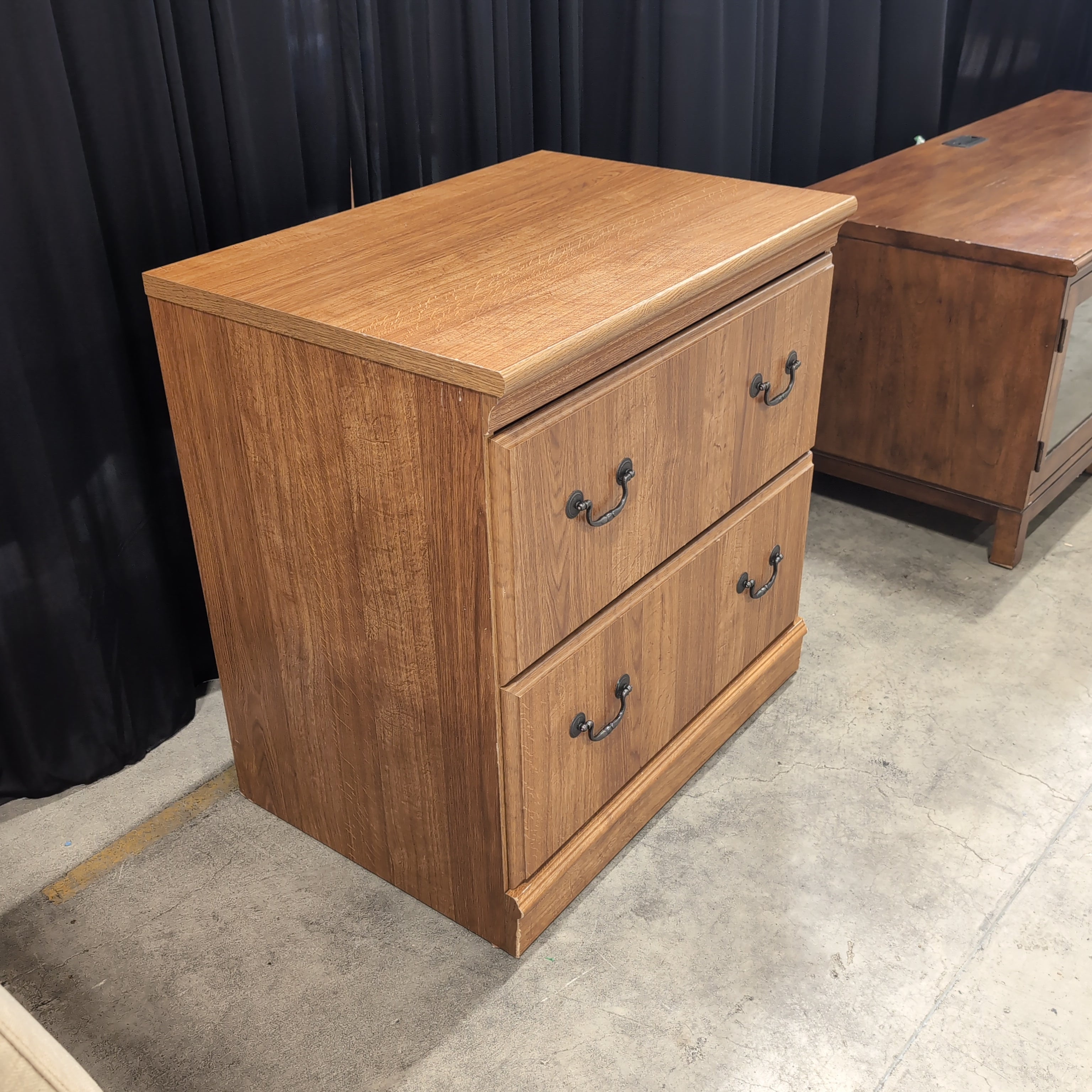 Brown Wood Three-Drawer Dresser with Dark Metal Pulls