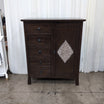 Dark Wood Five-Drawer Dresser with Ornate Panel