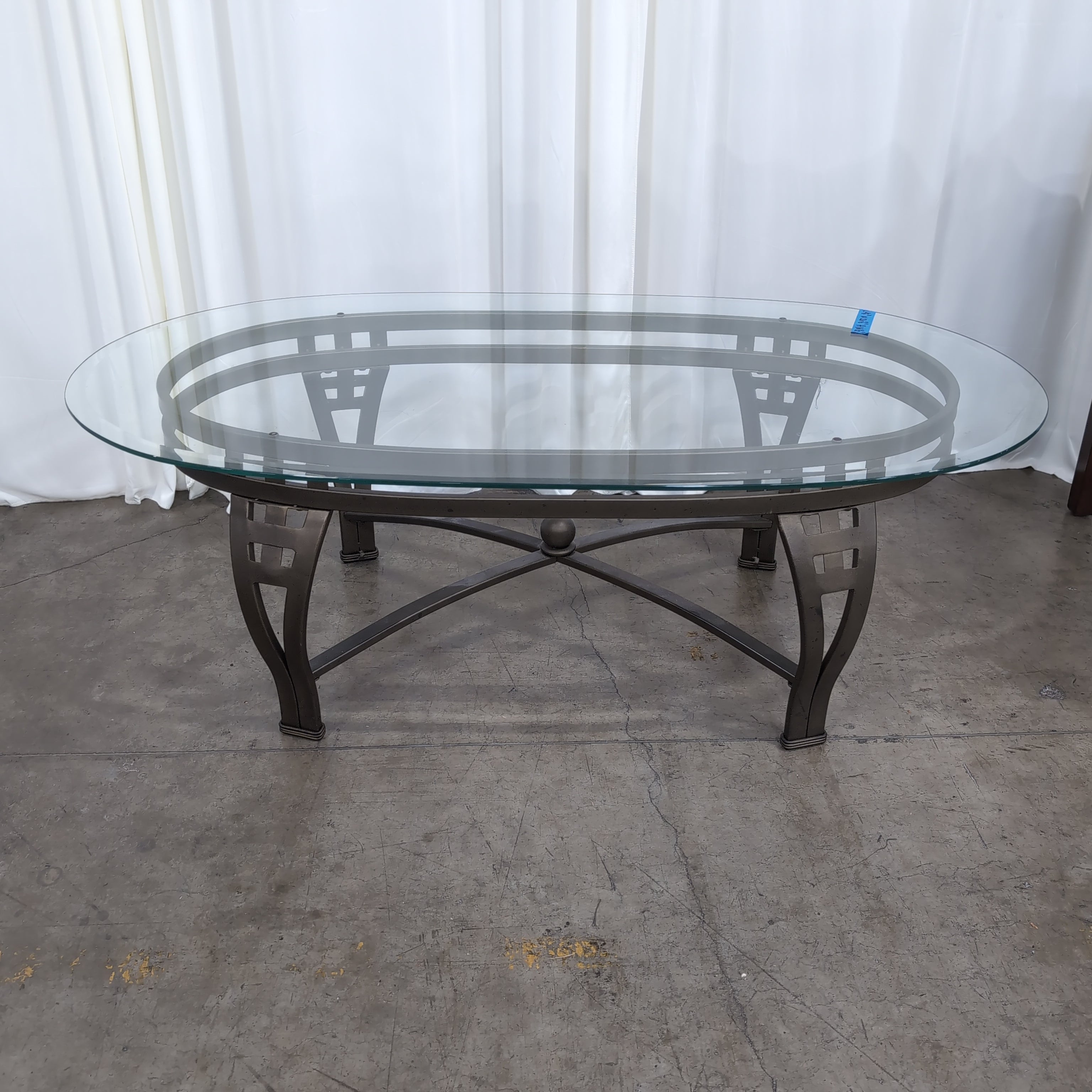 Oval Glass Coffee Table with Dark Metal Base