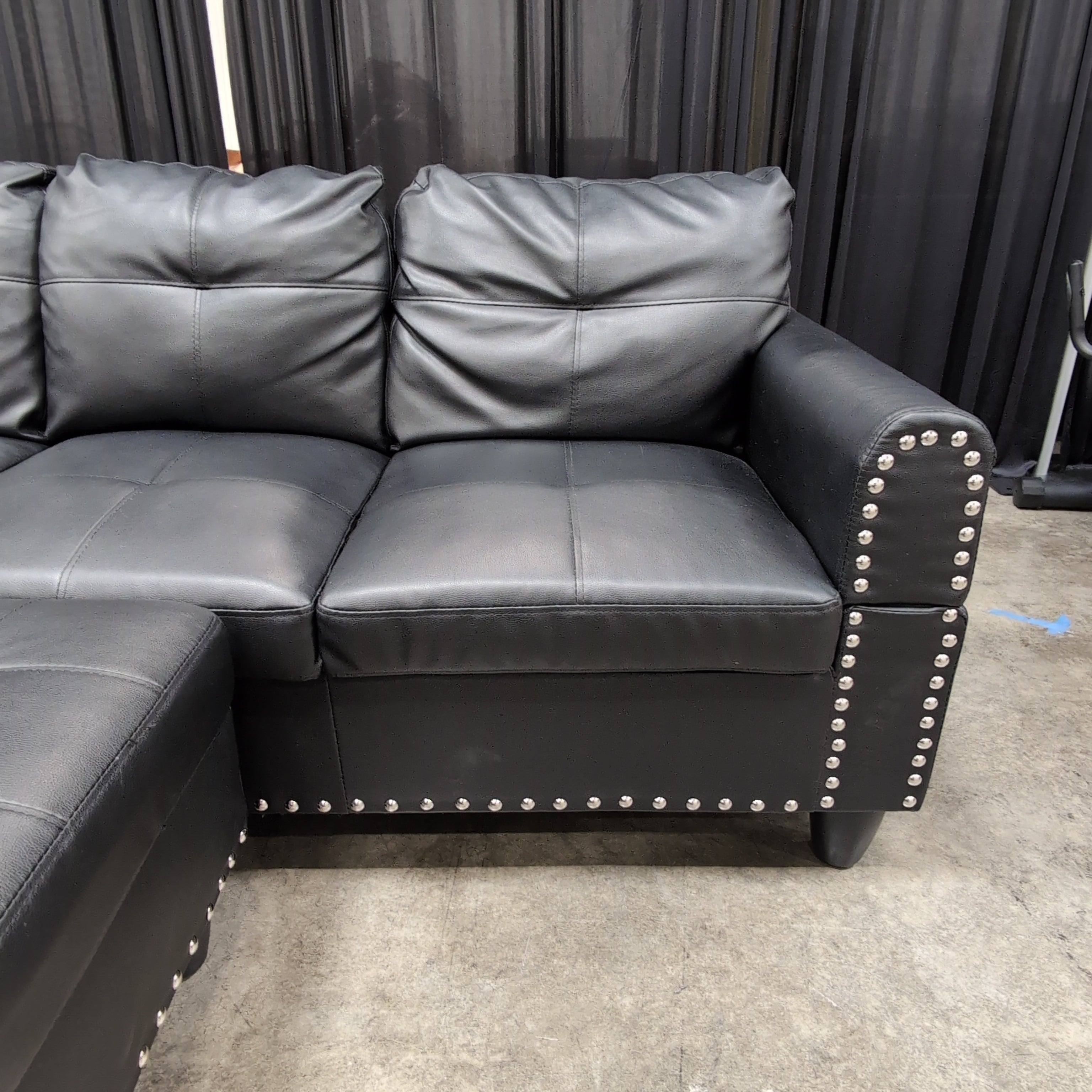 Black Faux Leather Sectional Couch with Ottoman