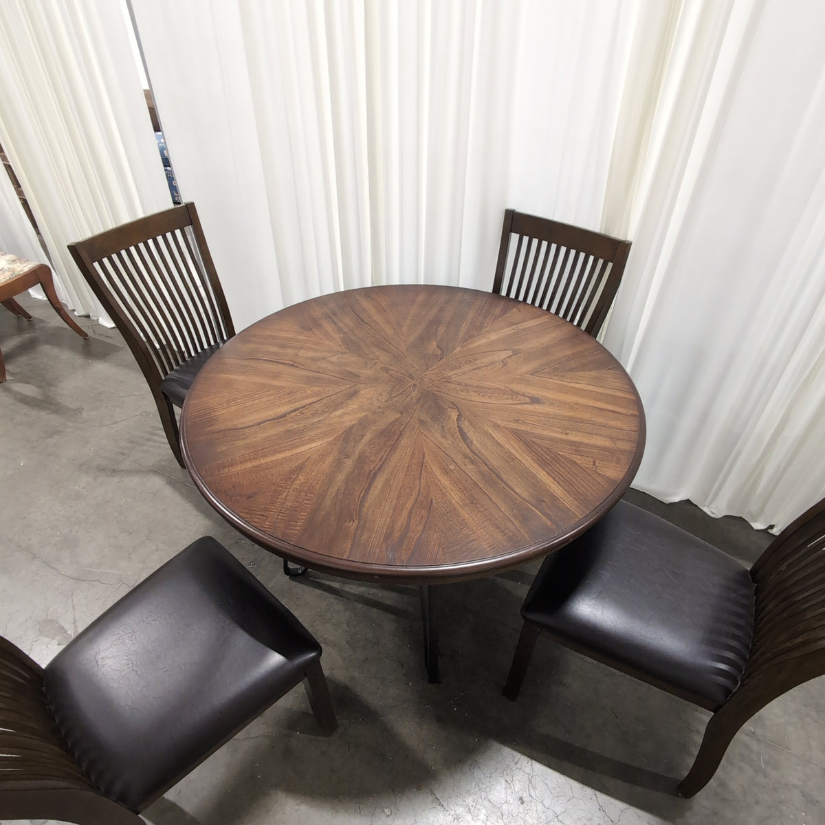 Round Dark Wood Dining Table with Sunburst Veneer