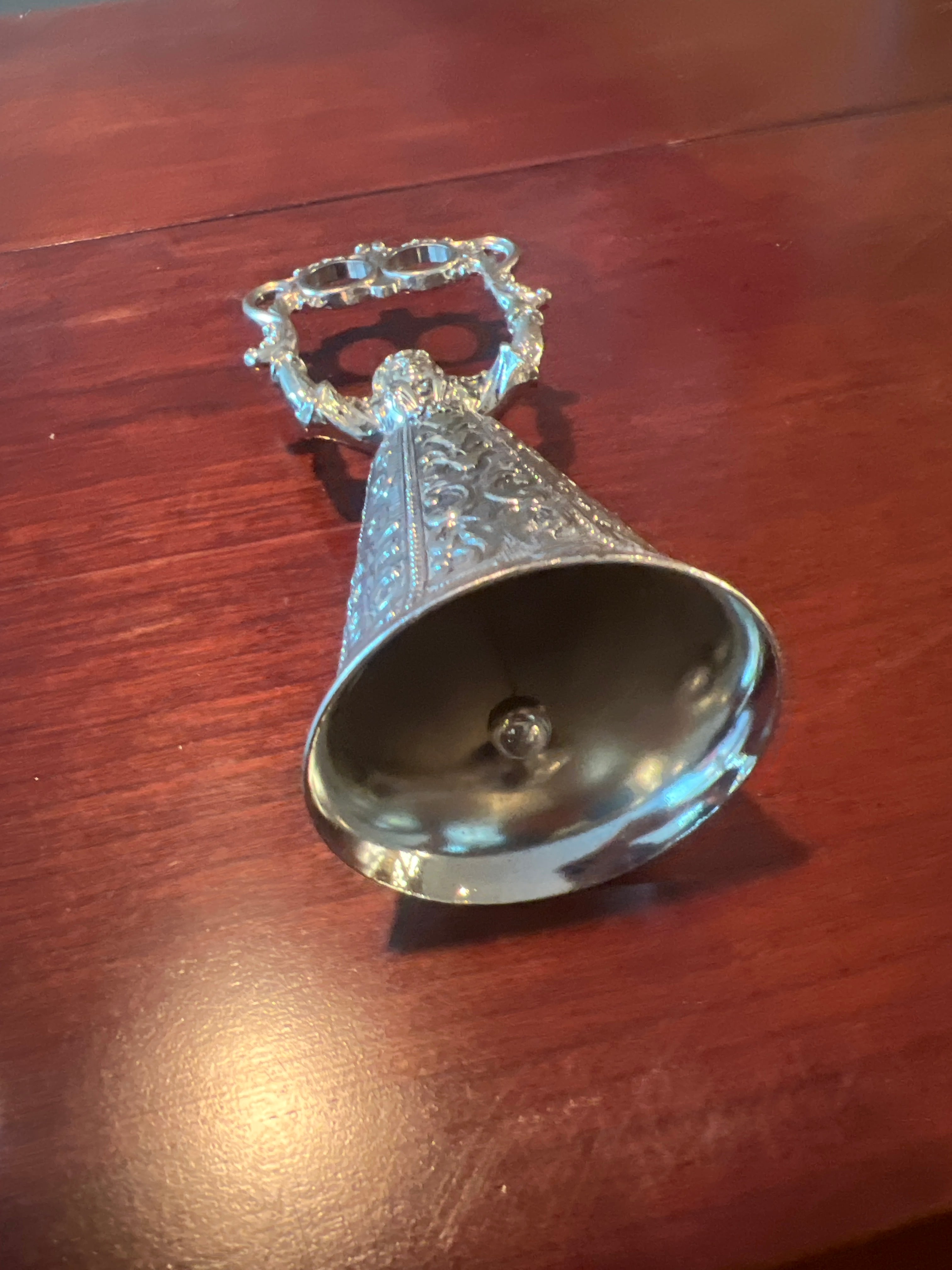 Ornate Metallic Decorative Bell with Sculpted Base