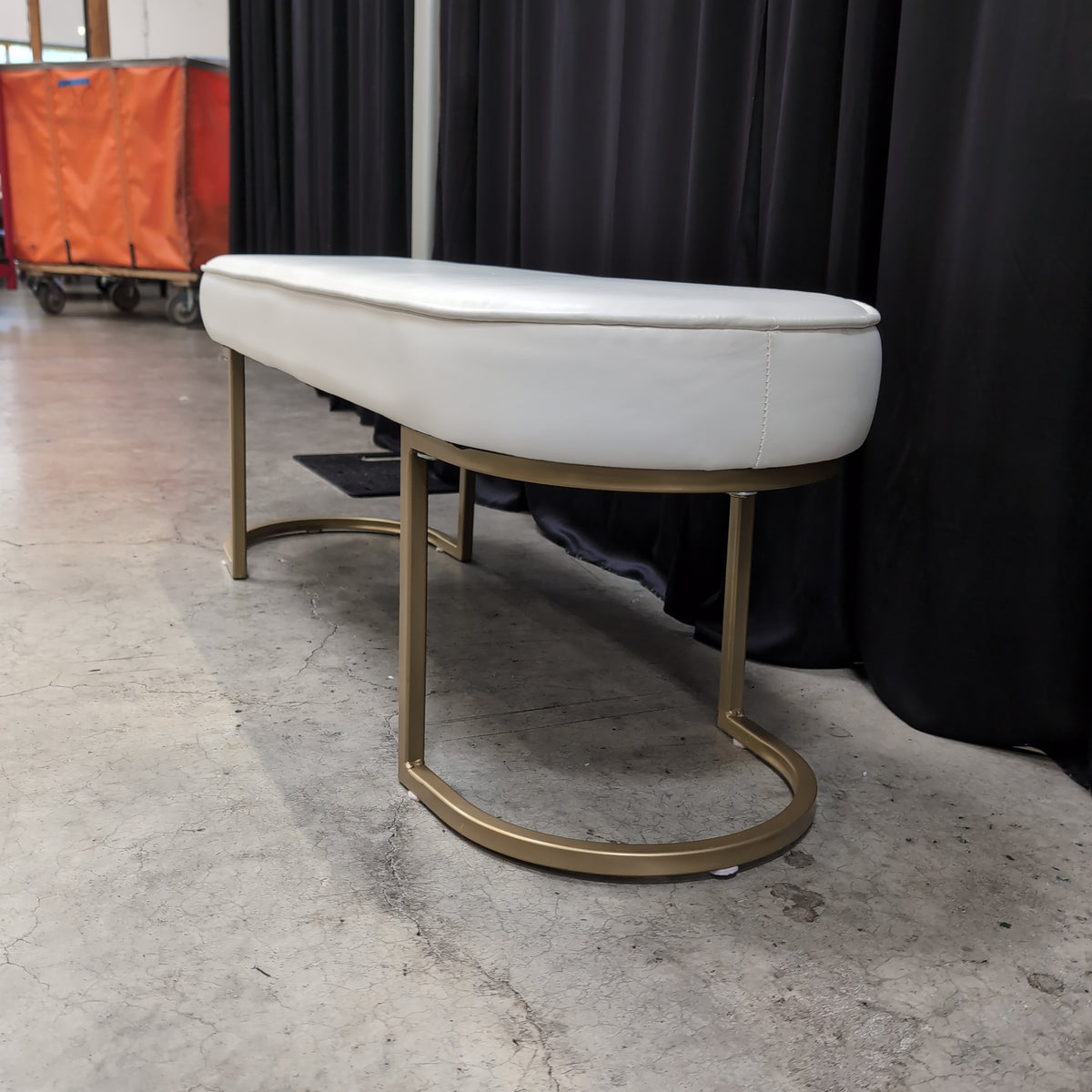 White Upholstered Oval Bench with Gold Base