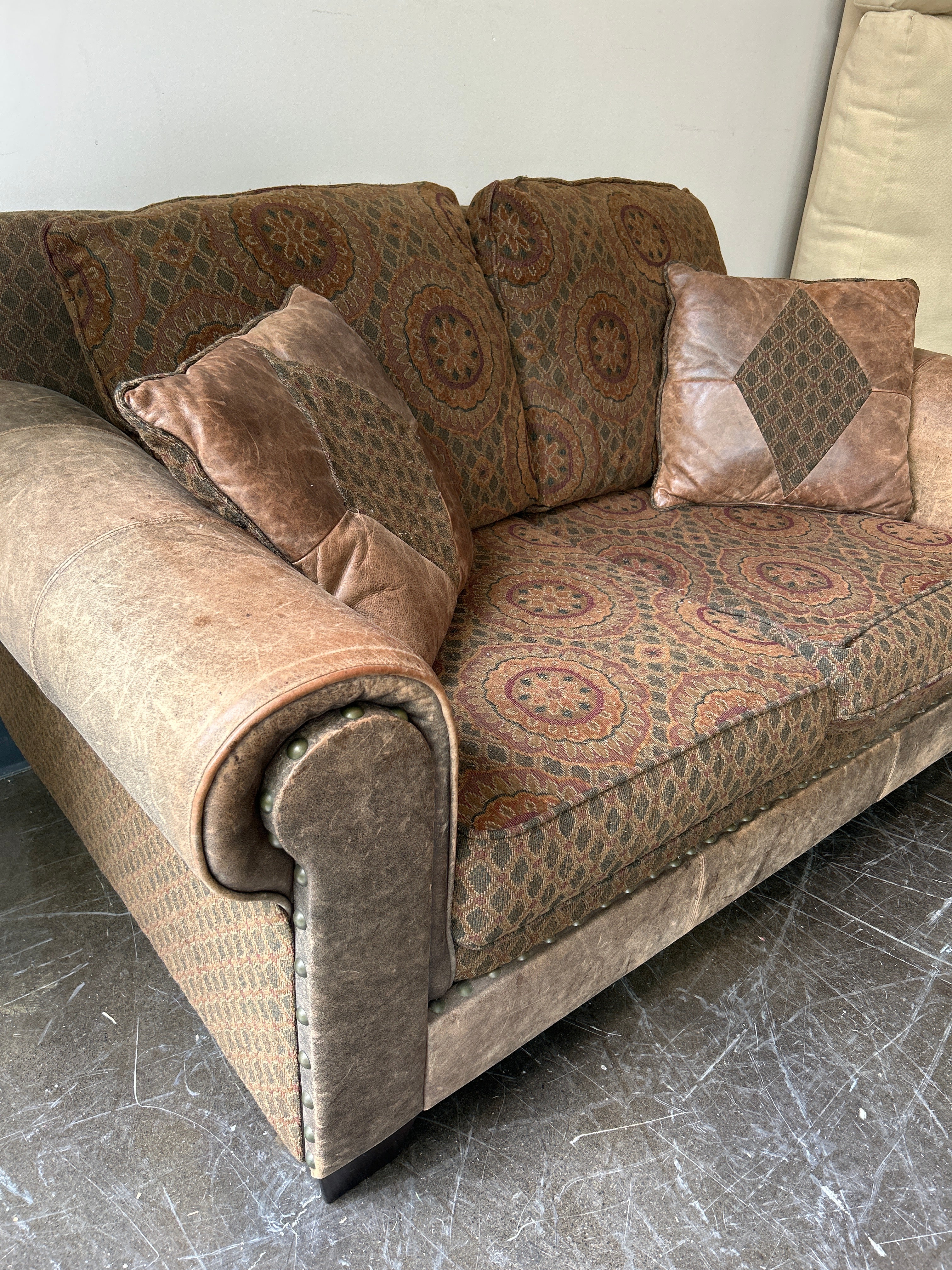 Brown and Rust Pattern Loveseat with Leather Accent