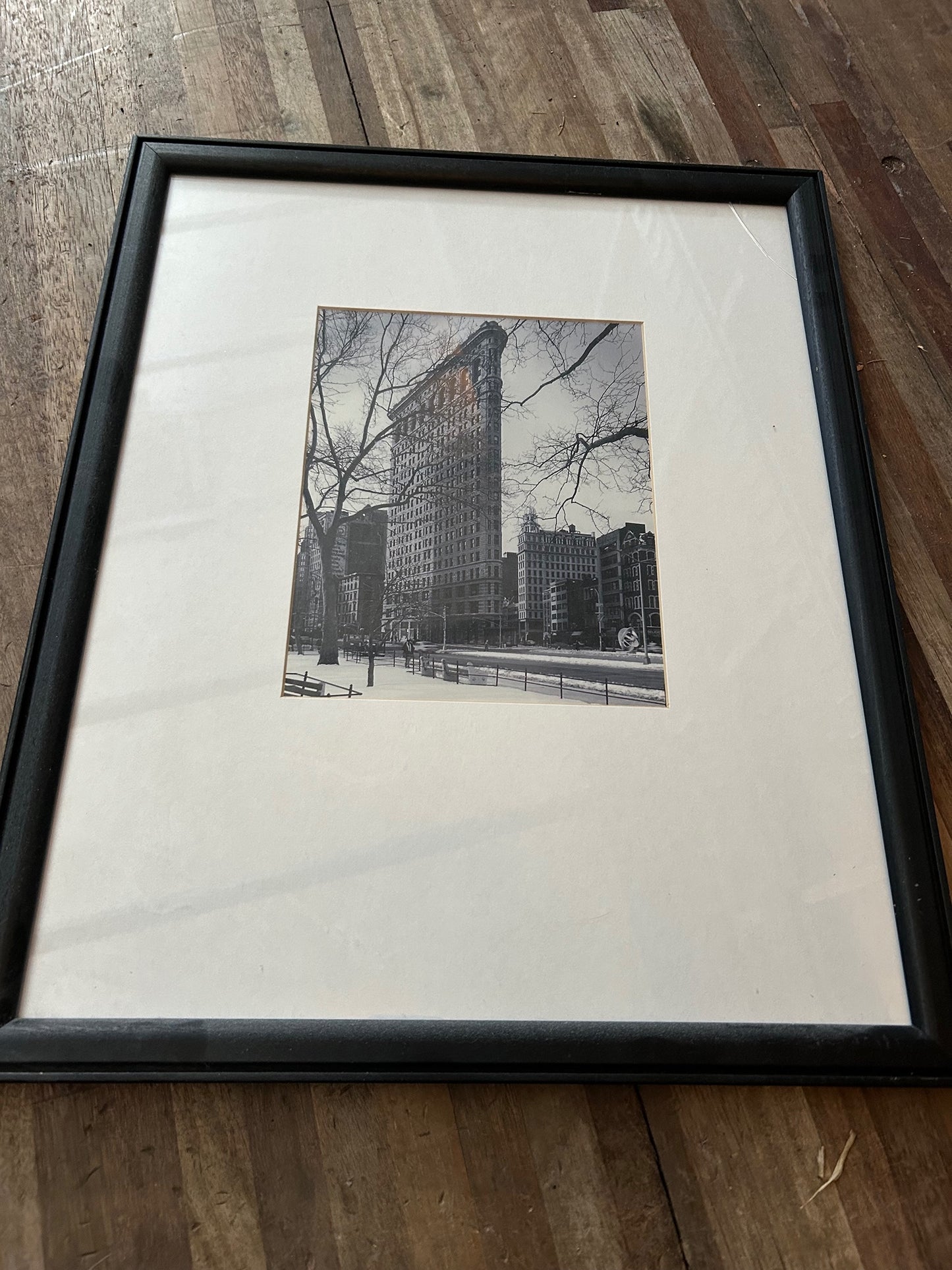 Black And White City Photo With Broken Corner on Frame
