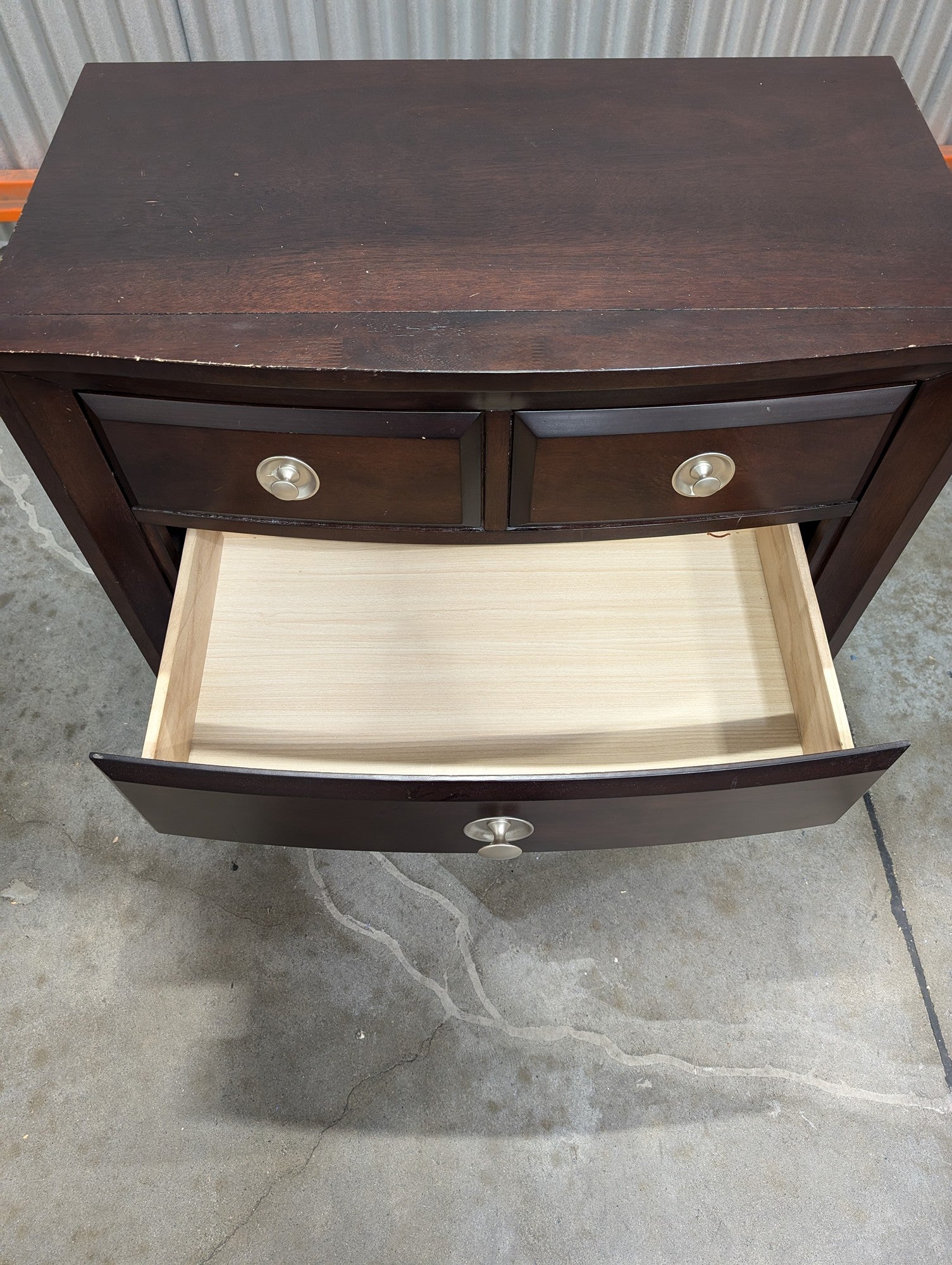 Rich Brown Wood Nightstand with Curved Drawer Fronts