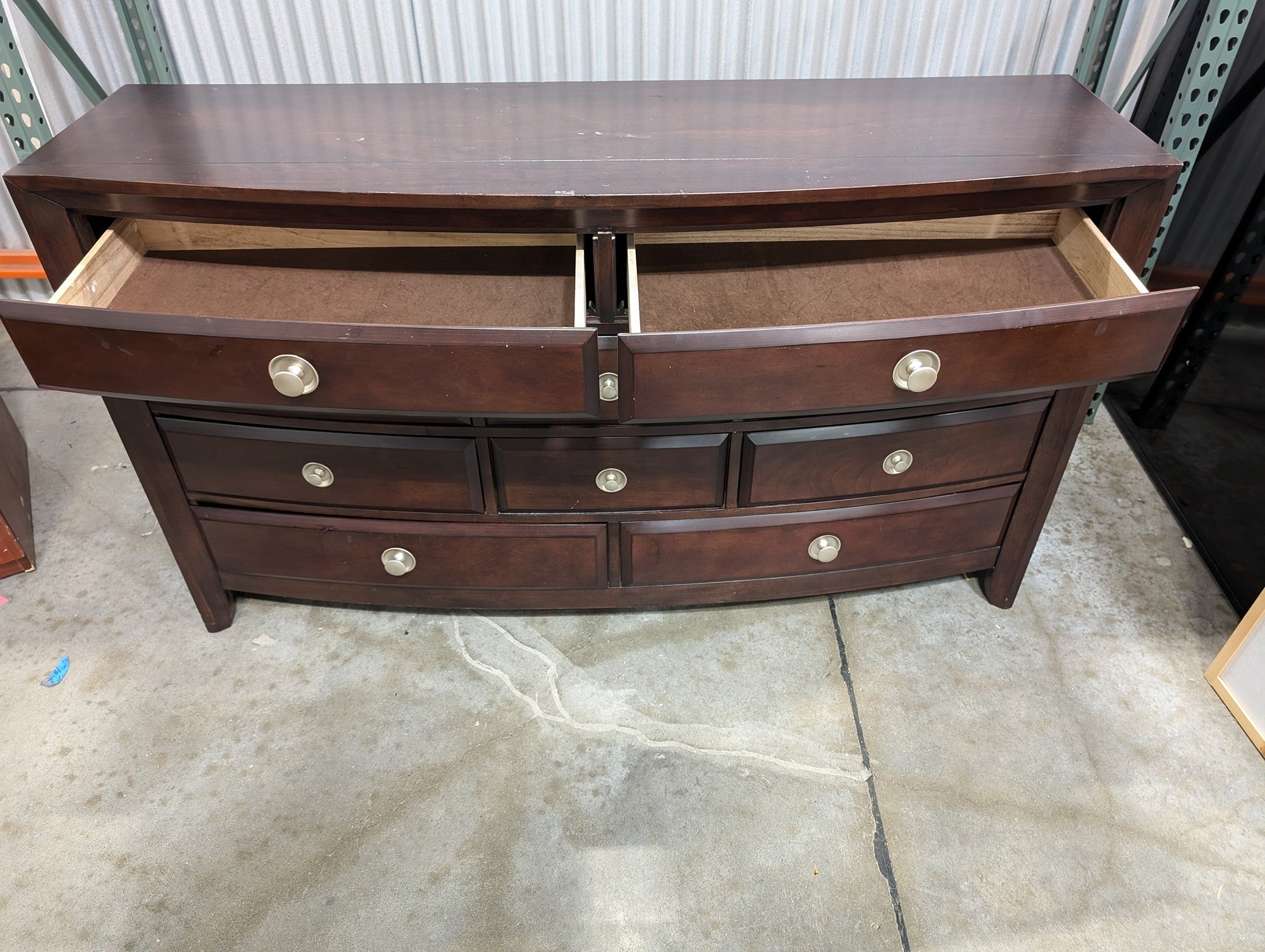 Dark Wood Curved Front Nine-Drawer Dresser