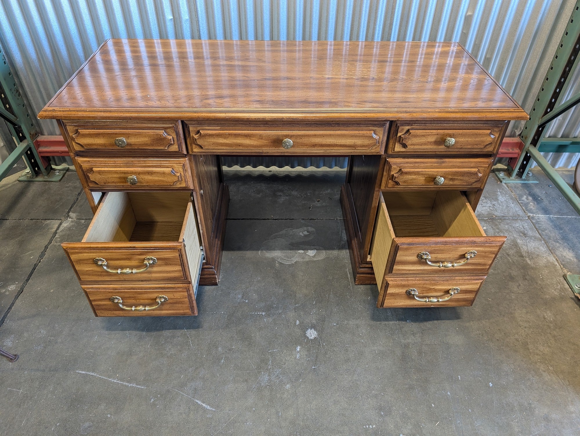 Light wood seven drawer desk