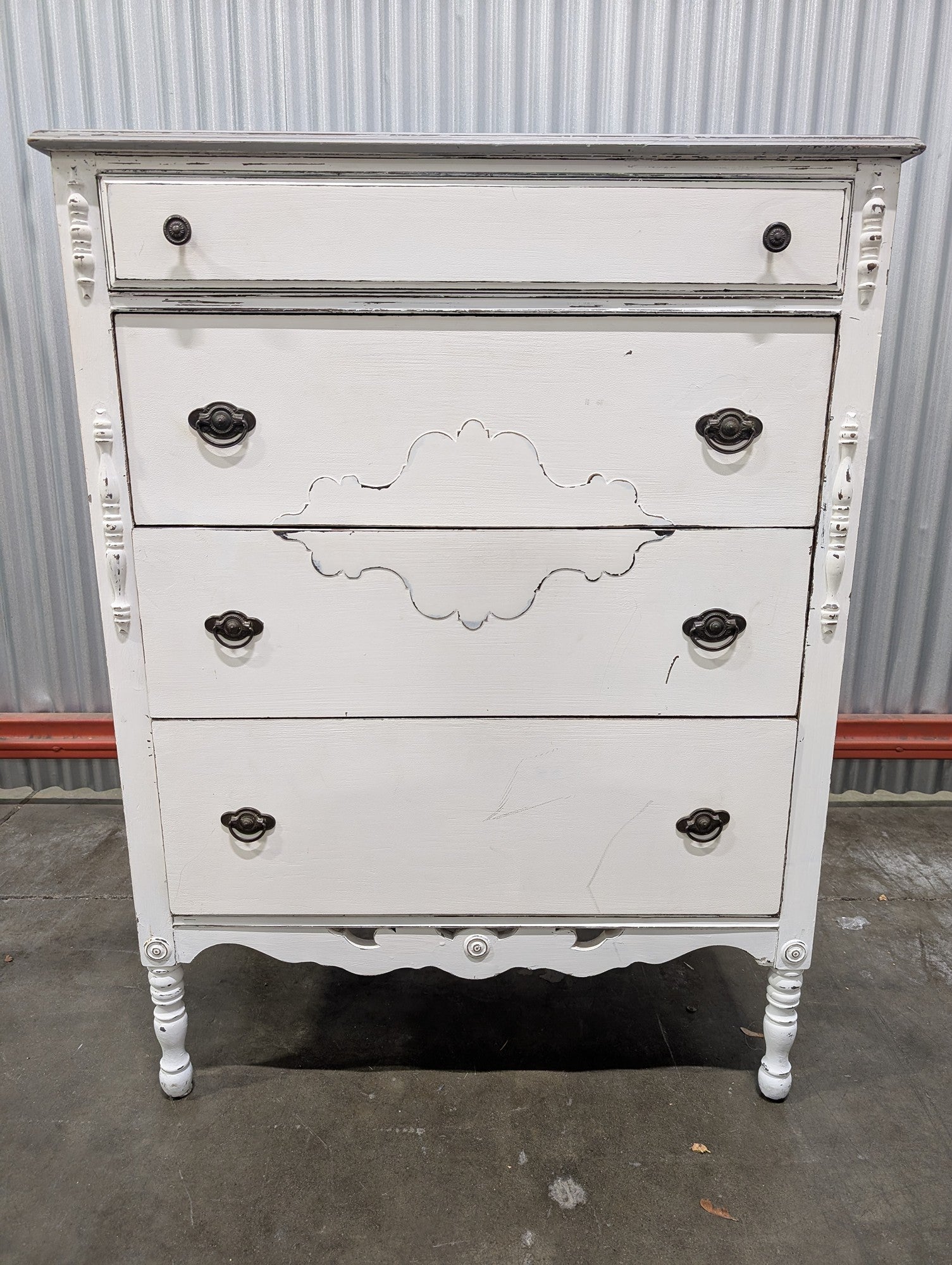 Distressed White Four-Drawer Chest with Carved Details