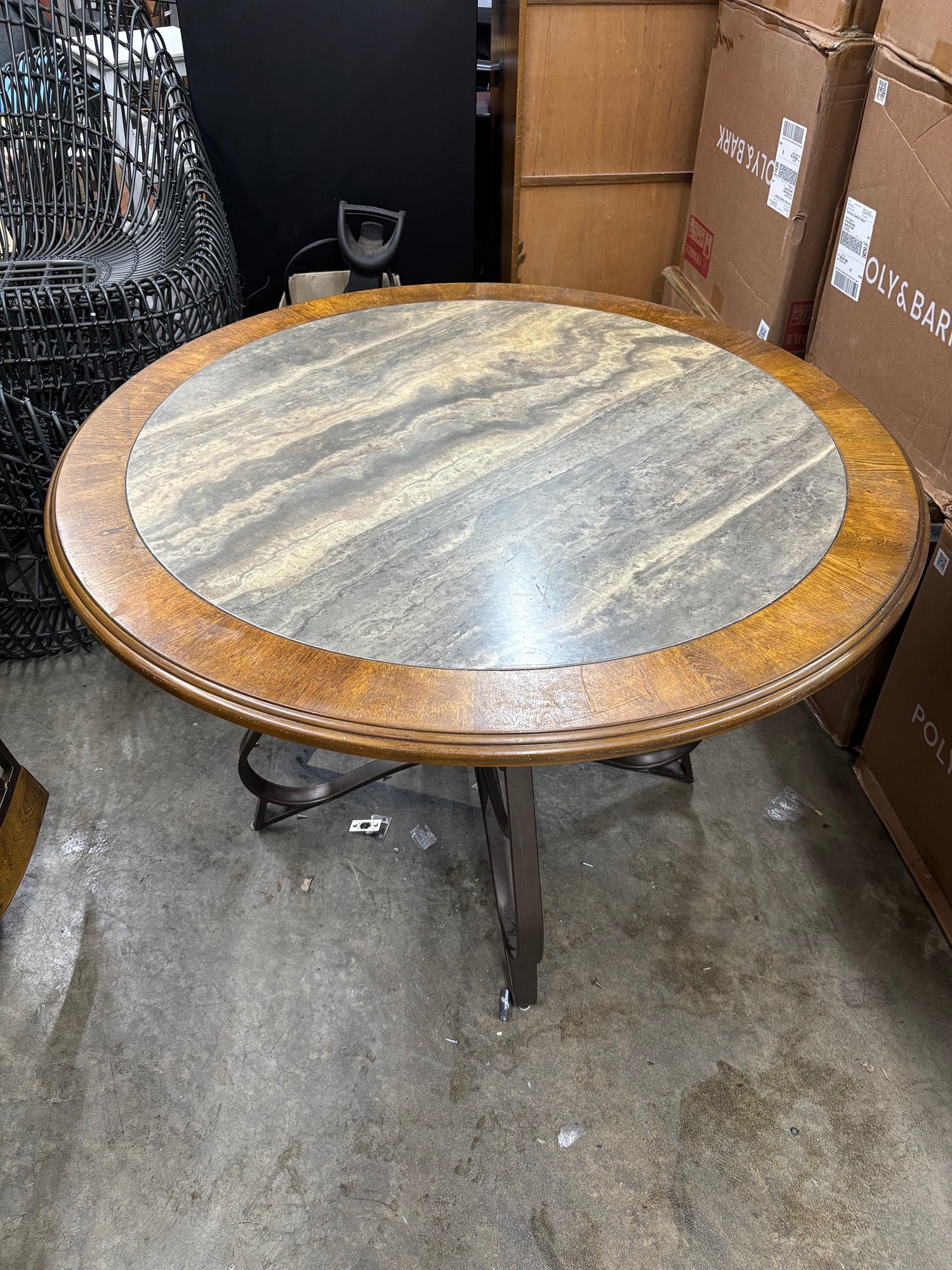 Round Stone Top Dining Table with Wood Trim and Metal Pedestal Base