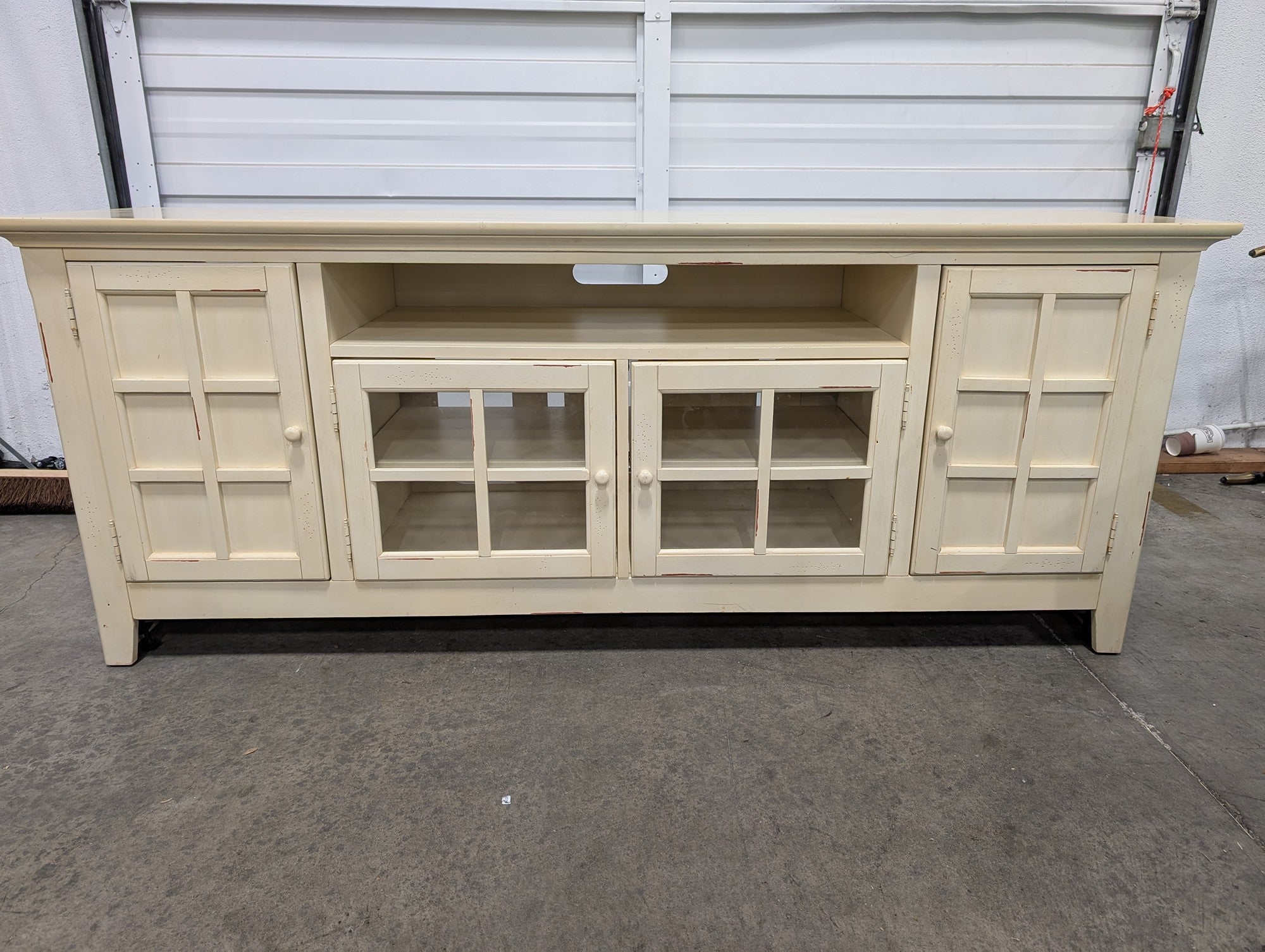 Distressed Cream Wood Media Console with Glass Doors