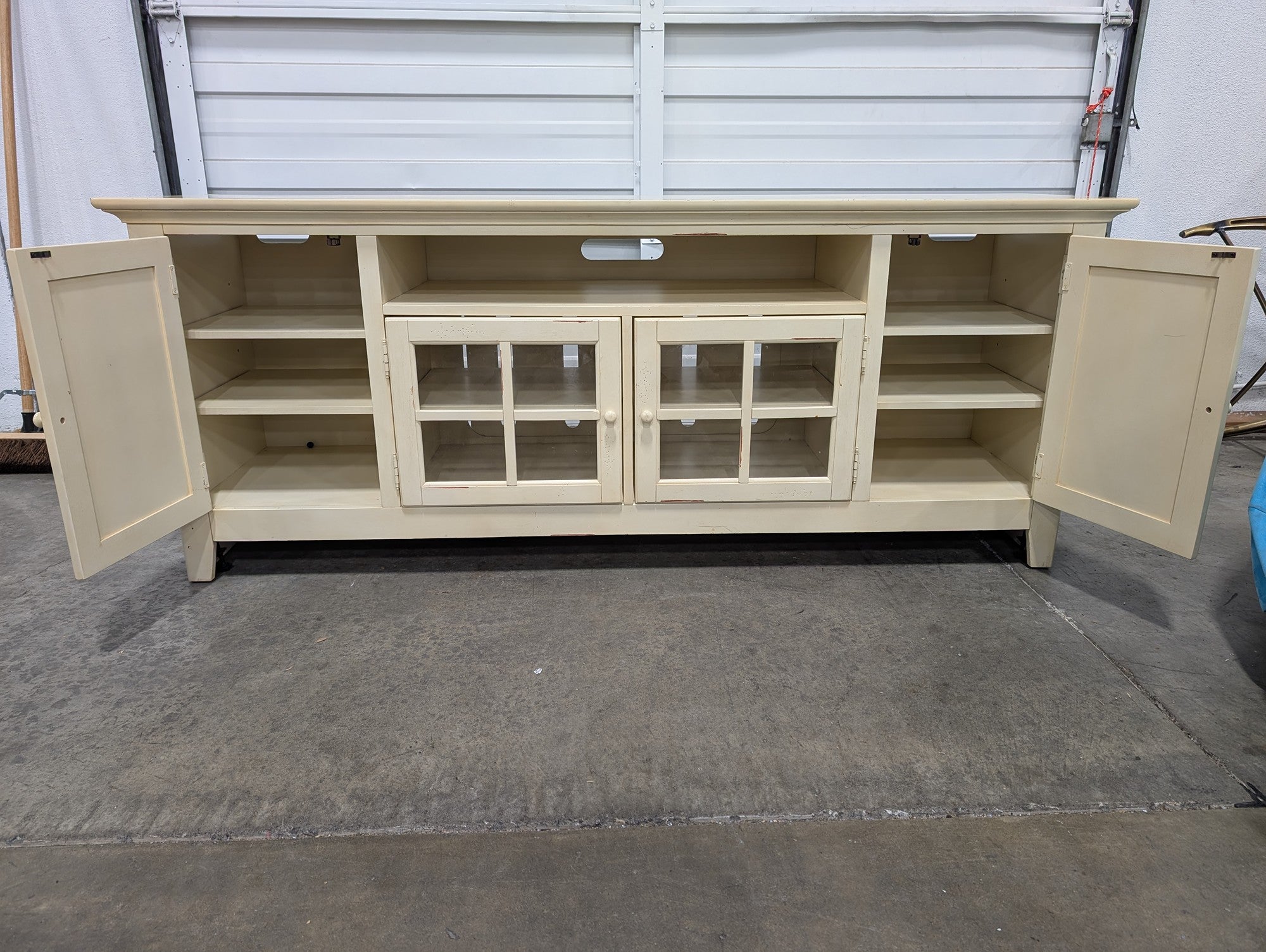 Distressed Cream Wood Media Console with Glass Doors