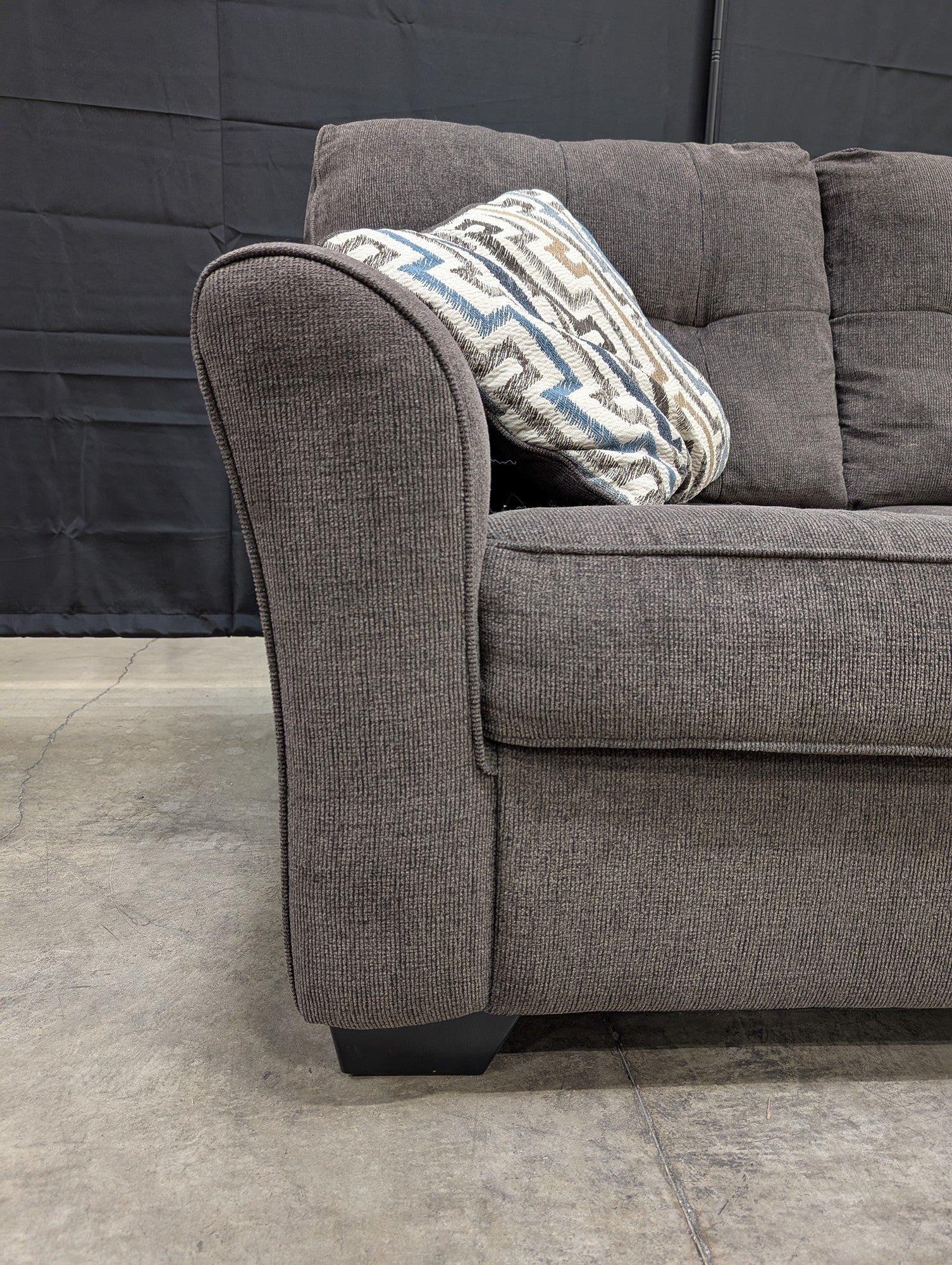 Compact Grey Textured Fabric Loveseat with Accent Pillows