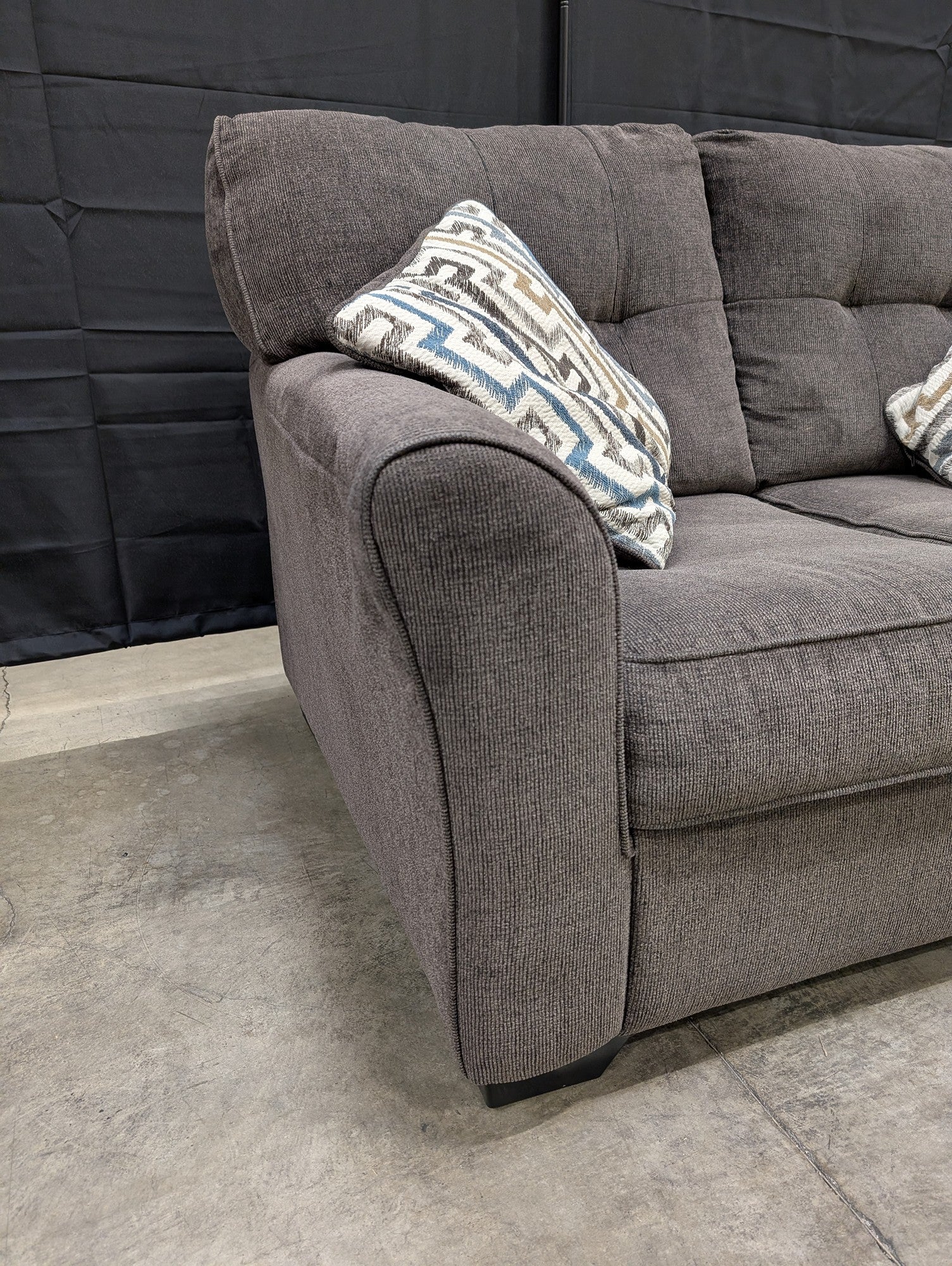 Compact Grey Textured Fabric Loveseat with Accent Pillows