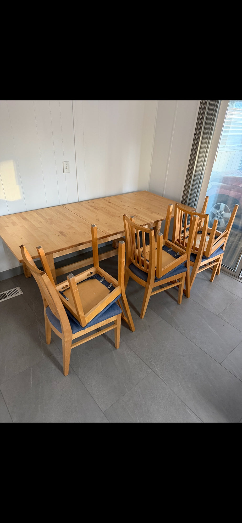 Versatile Extendable Light Wood Dining Table with Six Blue Upholstered Chairs