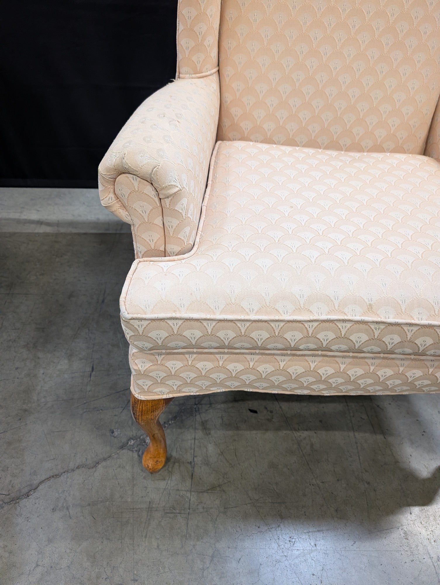 Traditional Upholstered Wingback Armchair with Scalloped Pattern
