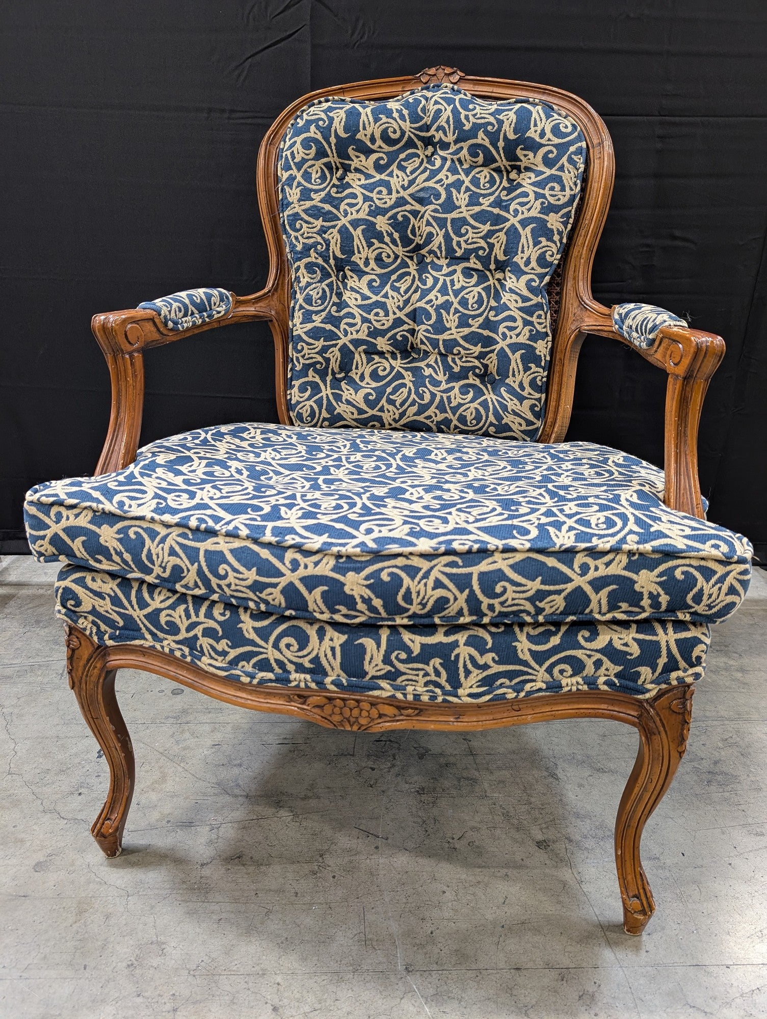 French Provincial Carved Wood Armchair with Cane Back