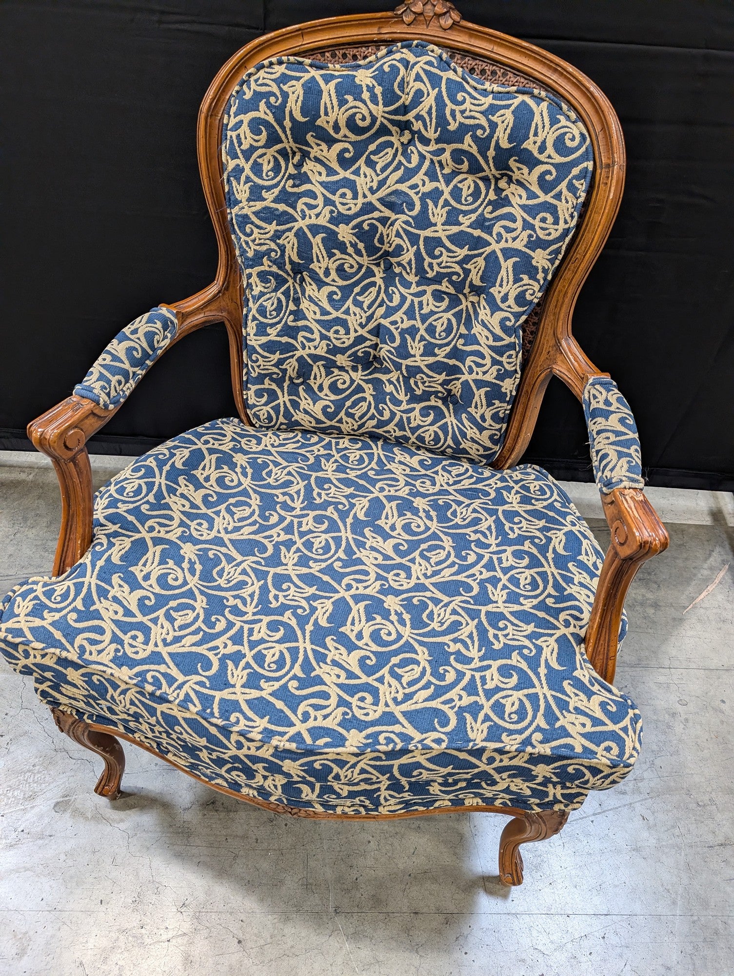 French Provincial Carved Wood Armchair with Cane Back