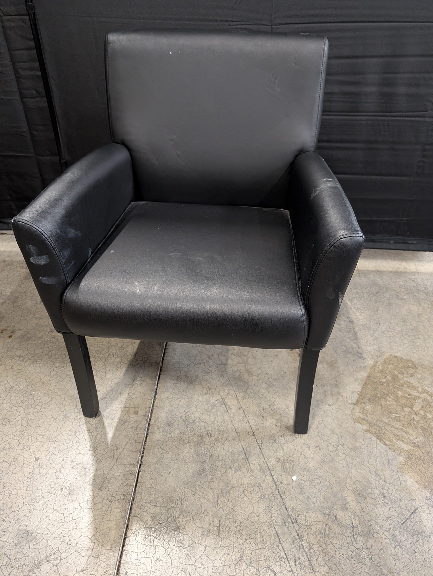 Modern Black Upholstered Armchair with Dark Legs