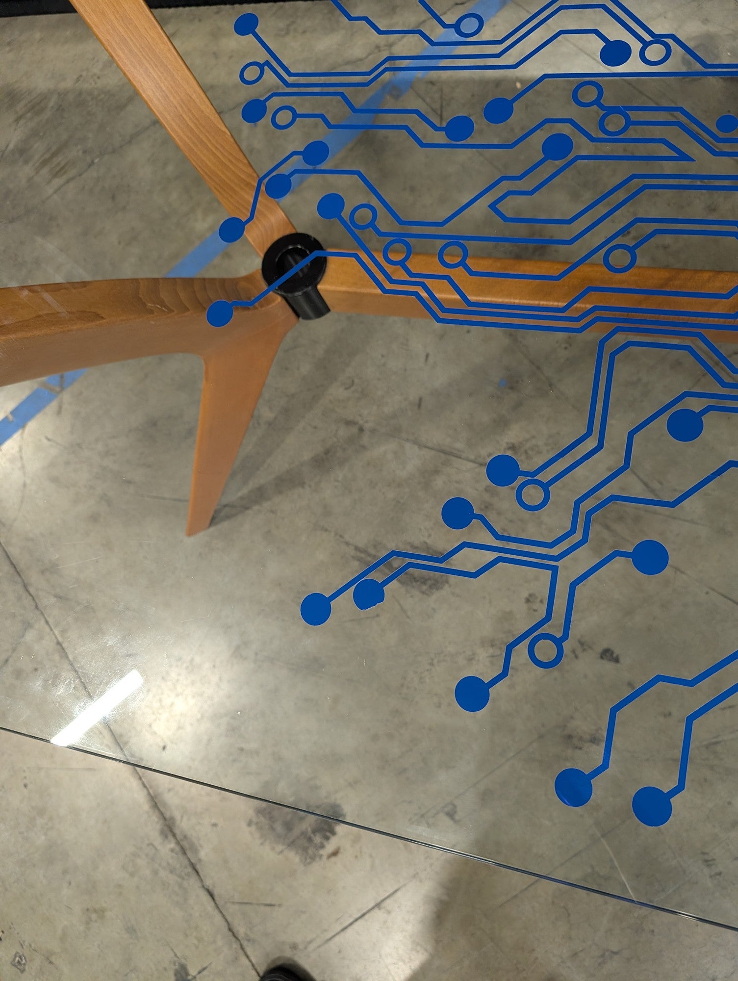 Modern Tech-Inspired Glass Top Dining Table with Splayed Wood Base