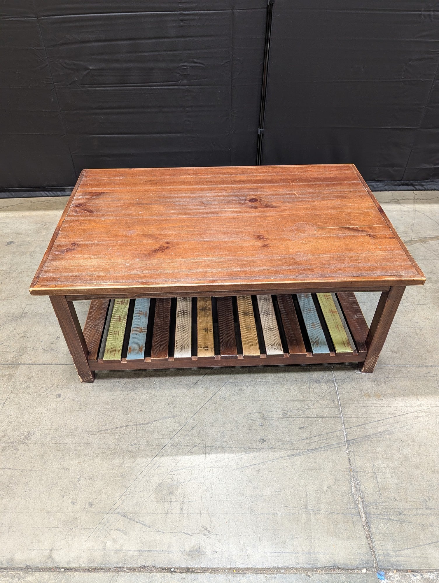 Rustic Wood Coffee Table with Multi-Color Slatted Shelf