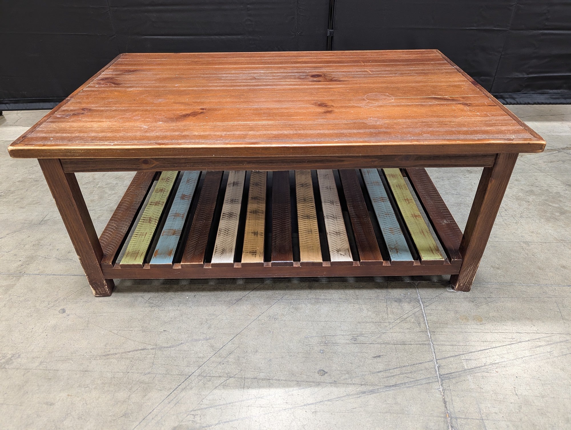 Rustic Wood Coffee Table with Multi-Color Slatted Shelf