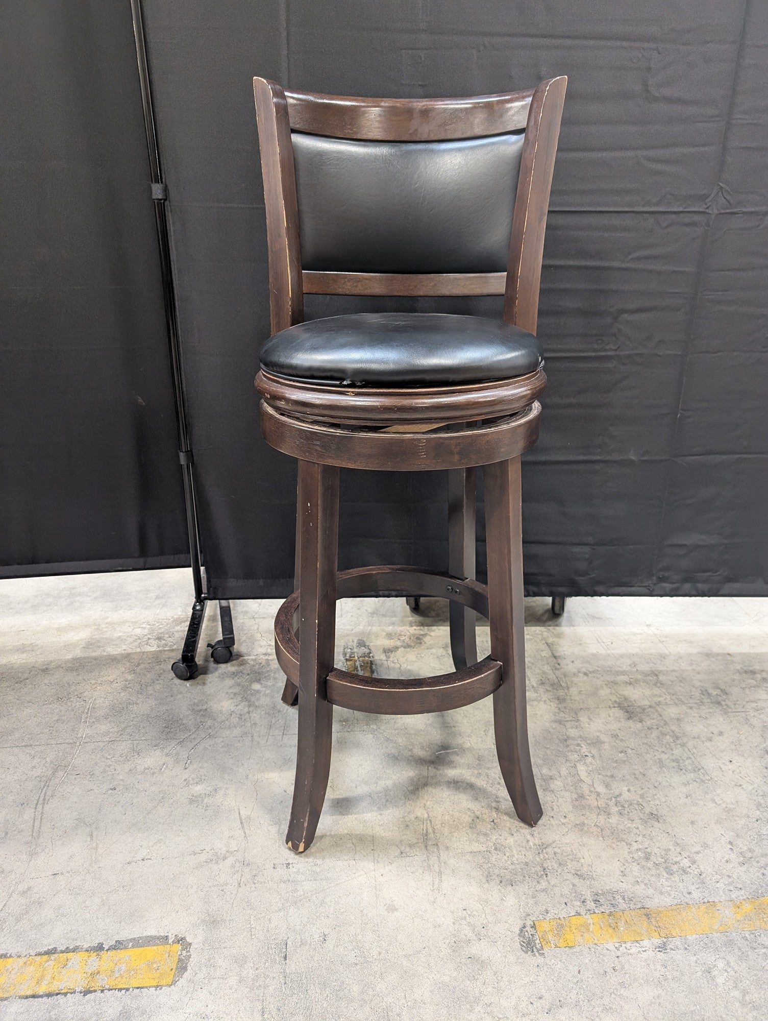 Dark Wood Swivel Bar Stool with Black Upholstery