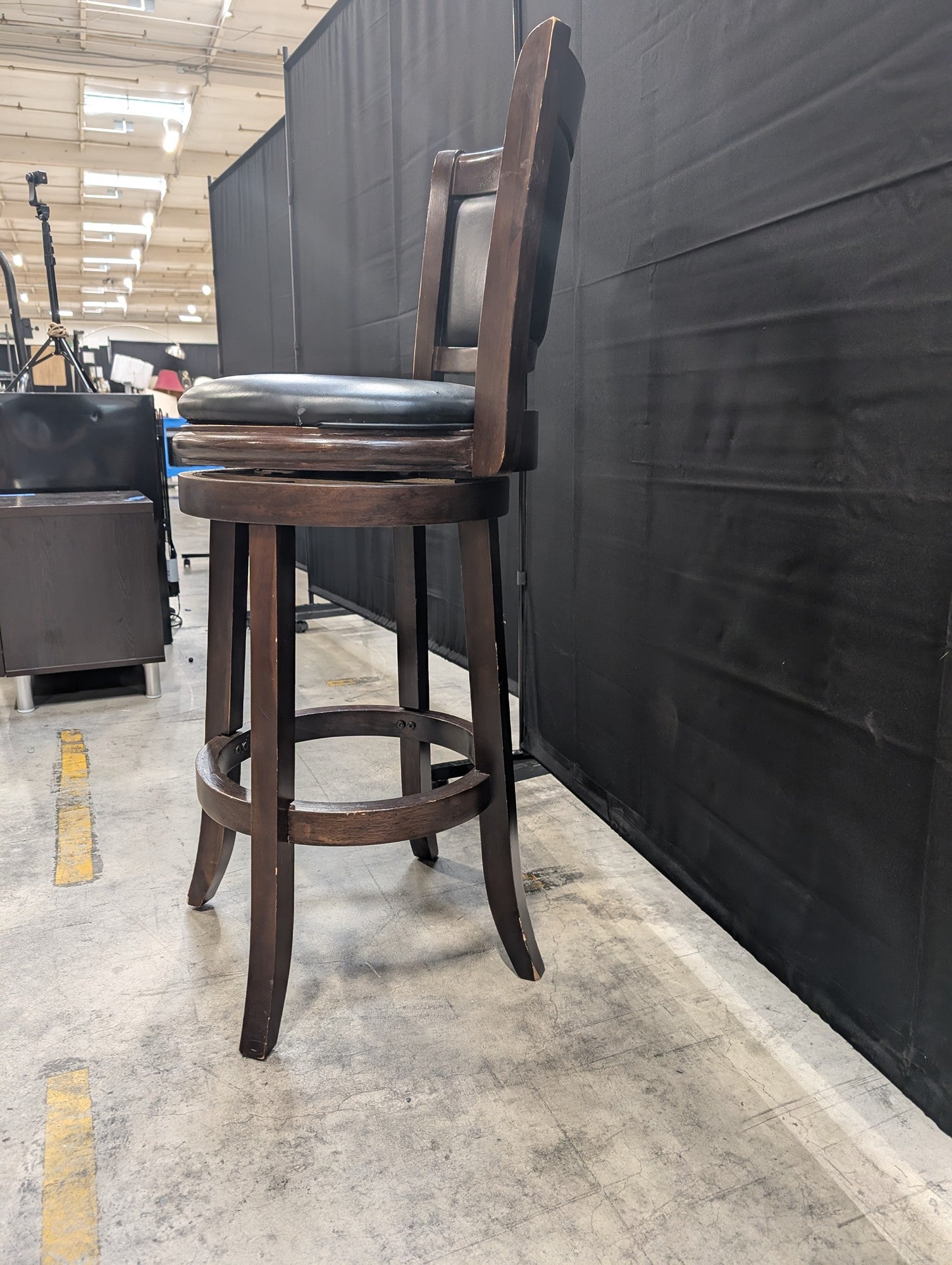 Dark Wood Swivel Bar Stool with Black Upholstery