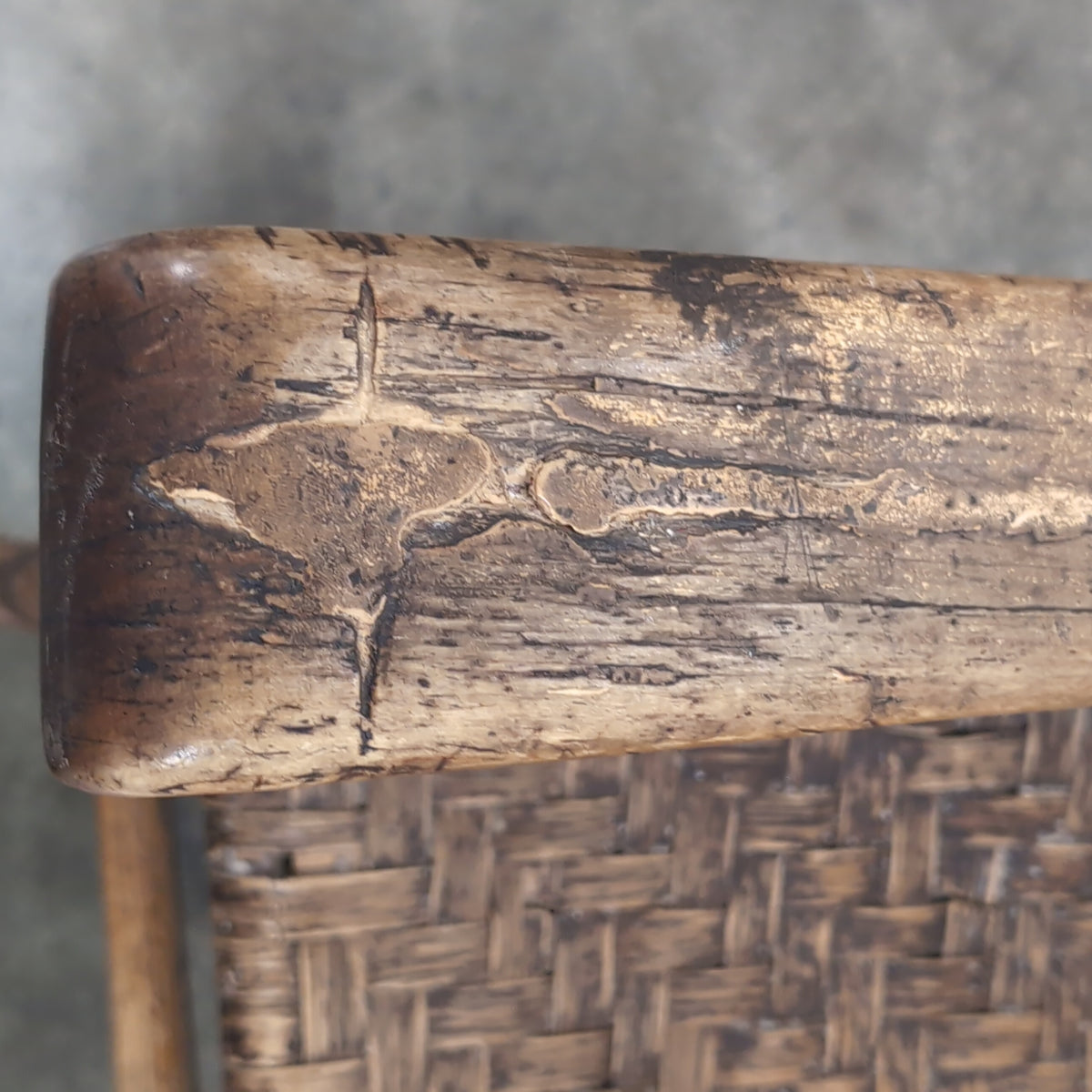 Brown Ladder-Back Rocking Chair with Woven Seat
