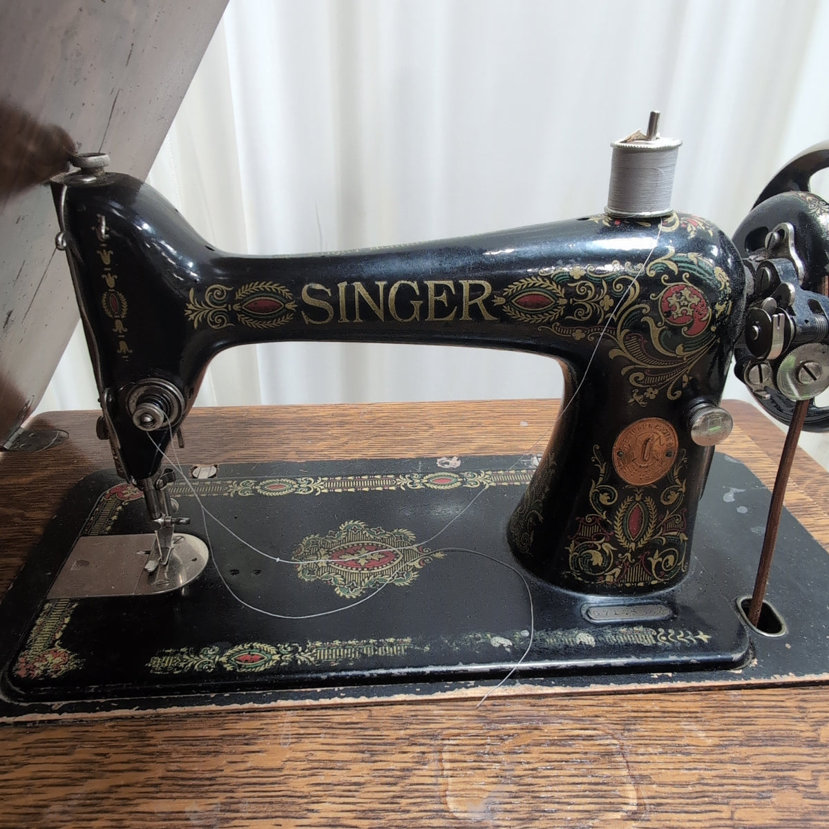 Vintage SINGER Sewing Machine with Dark Wood Cabinet