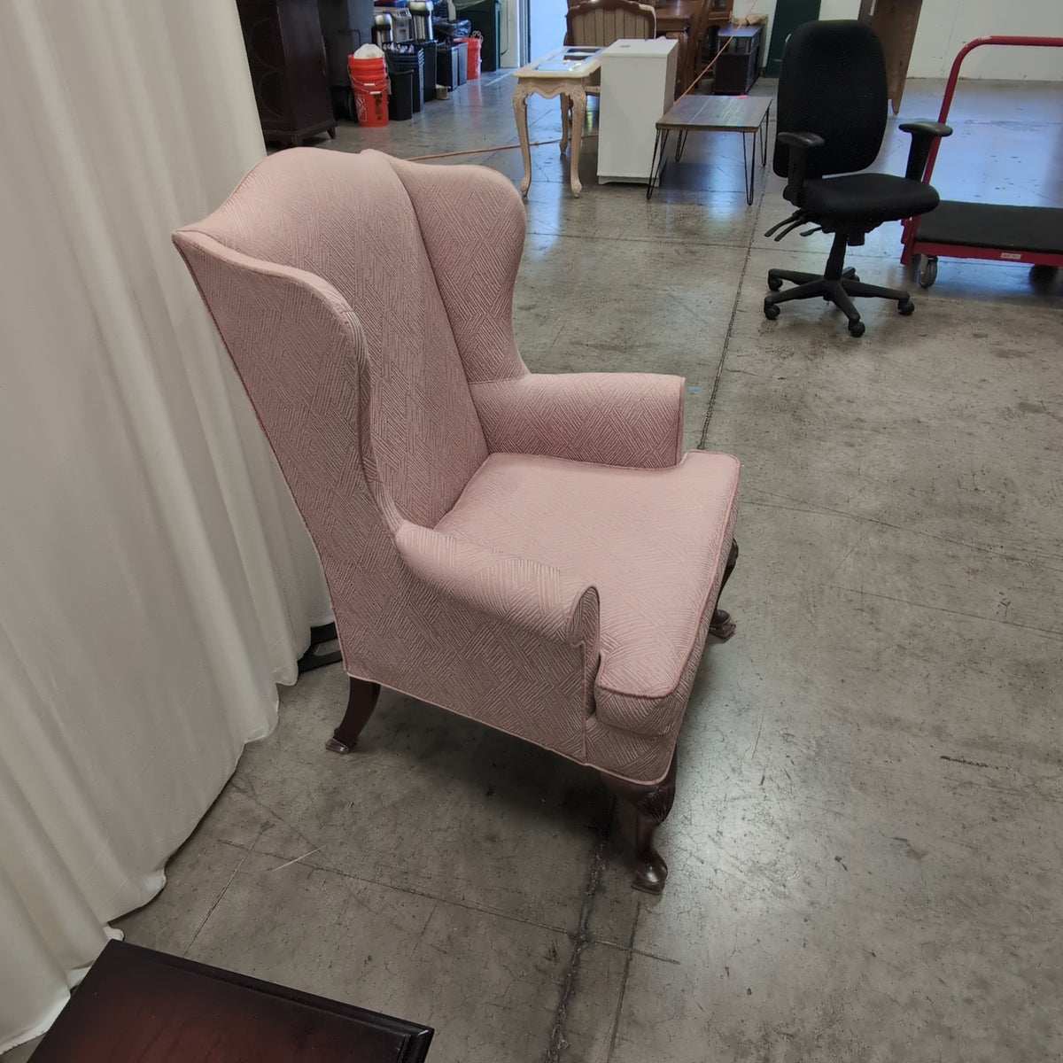 Mauve Upholstered Wingback Chair with Geometric Pattern