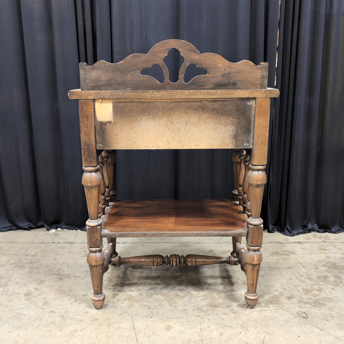 Dark Stained Wood Nightstand with Ornate Hardware