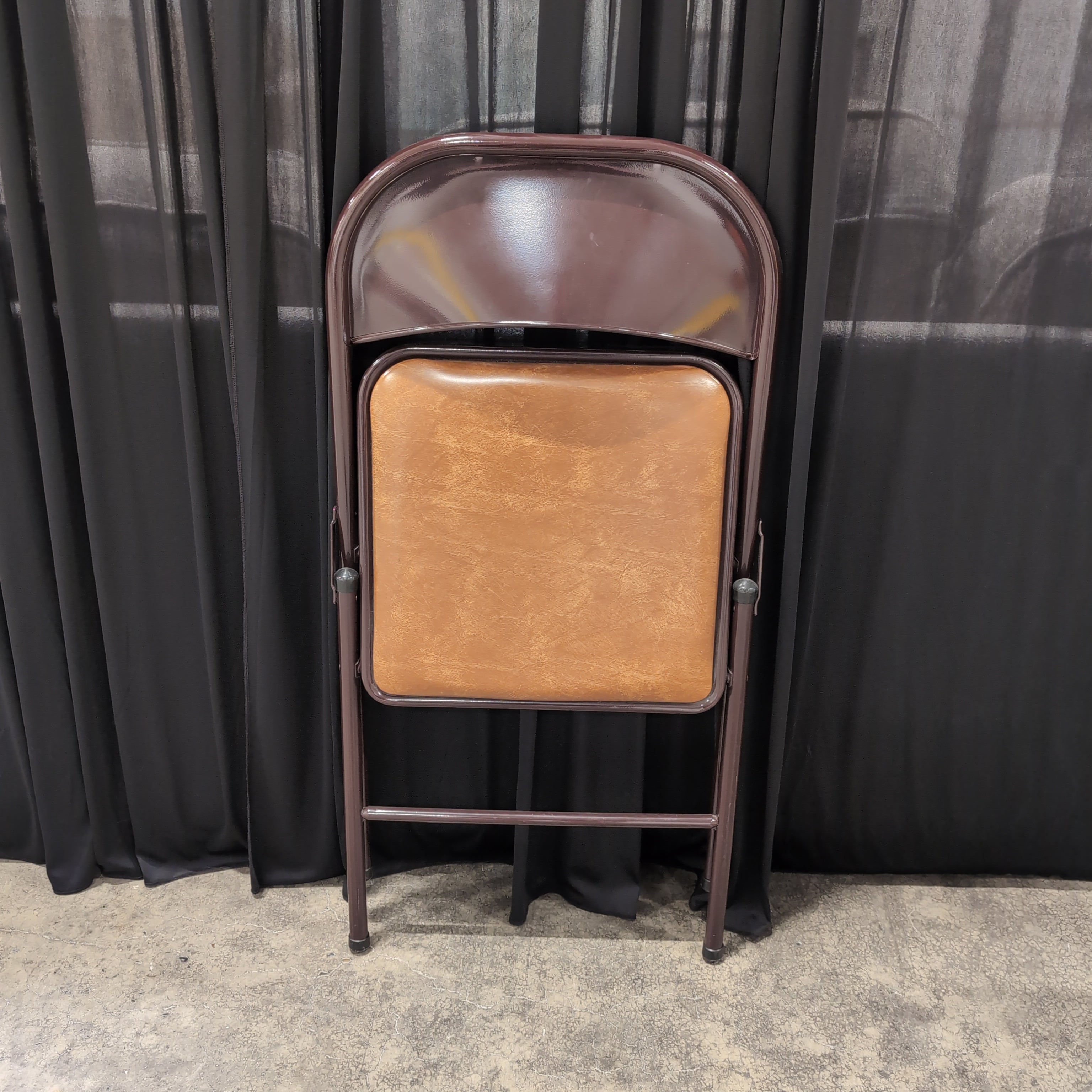 Brown Metal Folding Chair with Tan Upholstered Seat