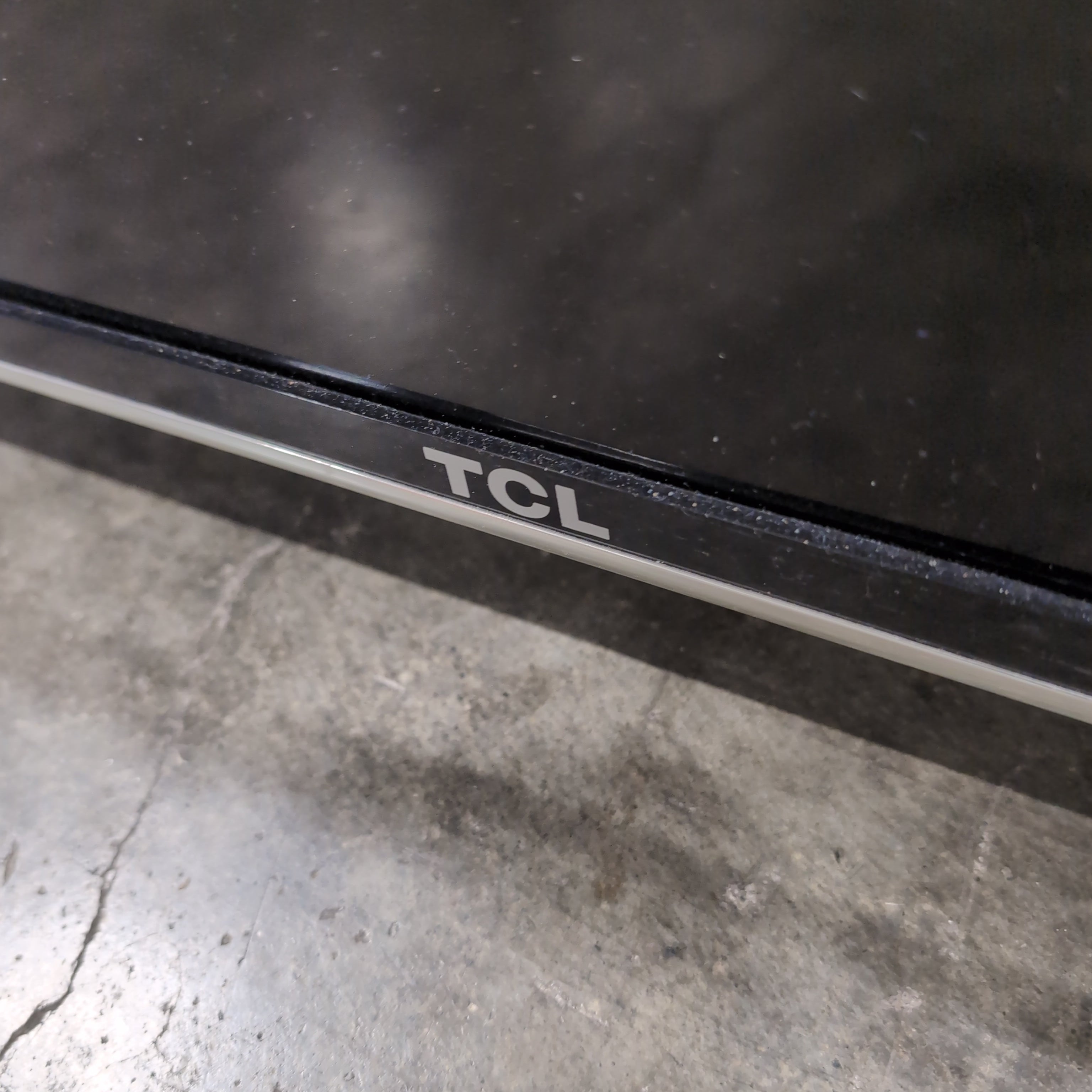 TCL 55-inch Black Flat Screen TV with Stand