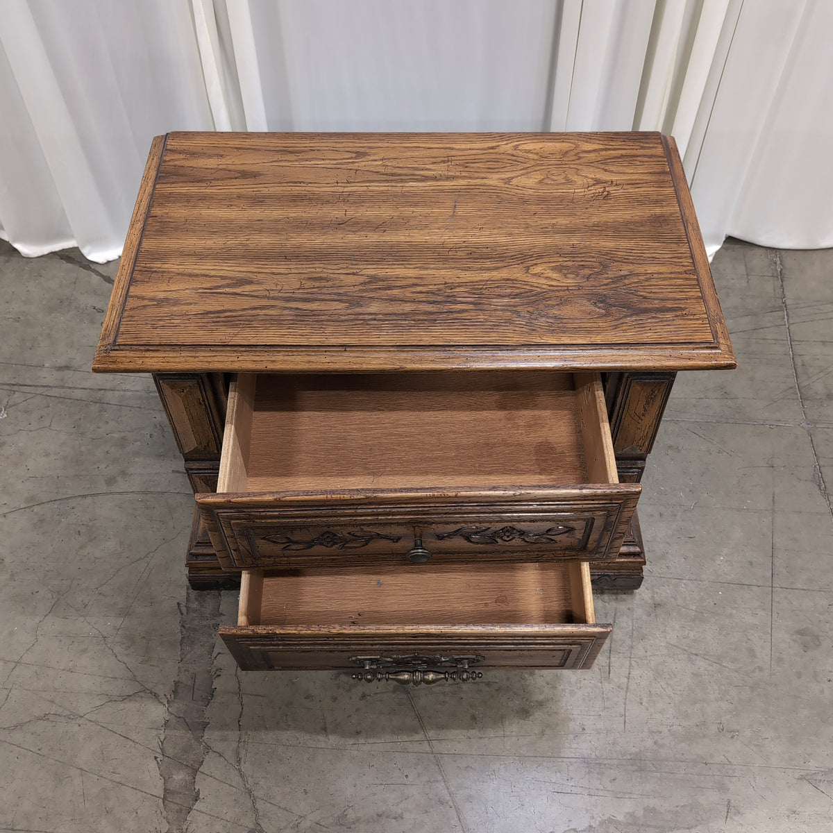 Traditional Dark Wood Two-Drawer Nightstand with Ornate Hardware