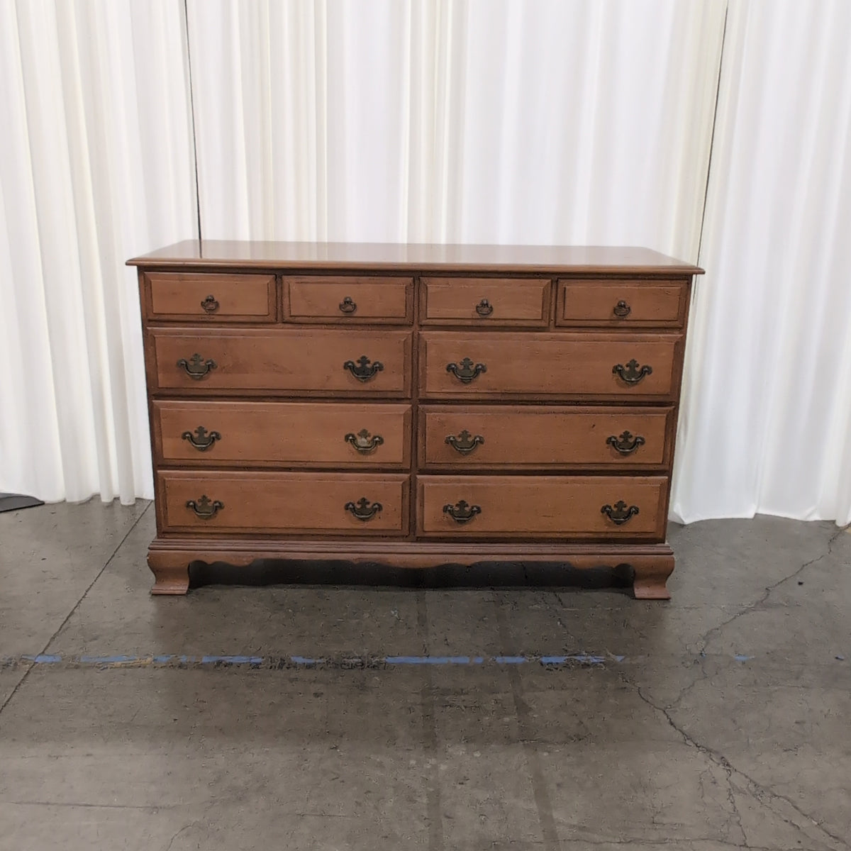 Traditional Honey Wood Nine-Drawer Dresser with Ornate Hardware