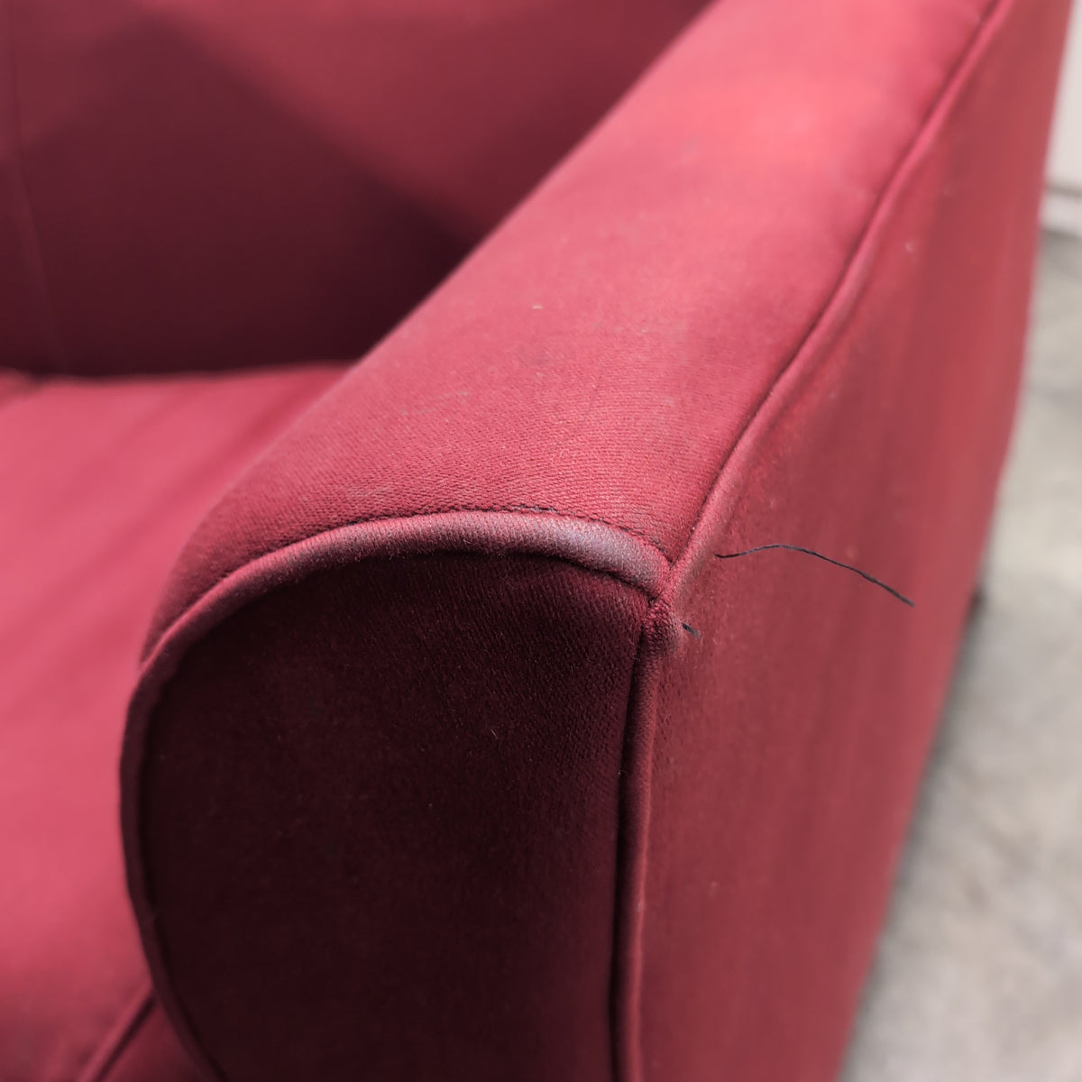 Red Upholstered Two-Cushion Fabric Loveseat with Dark Wood Base