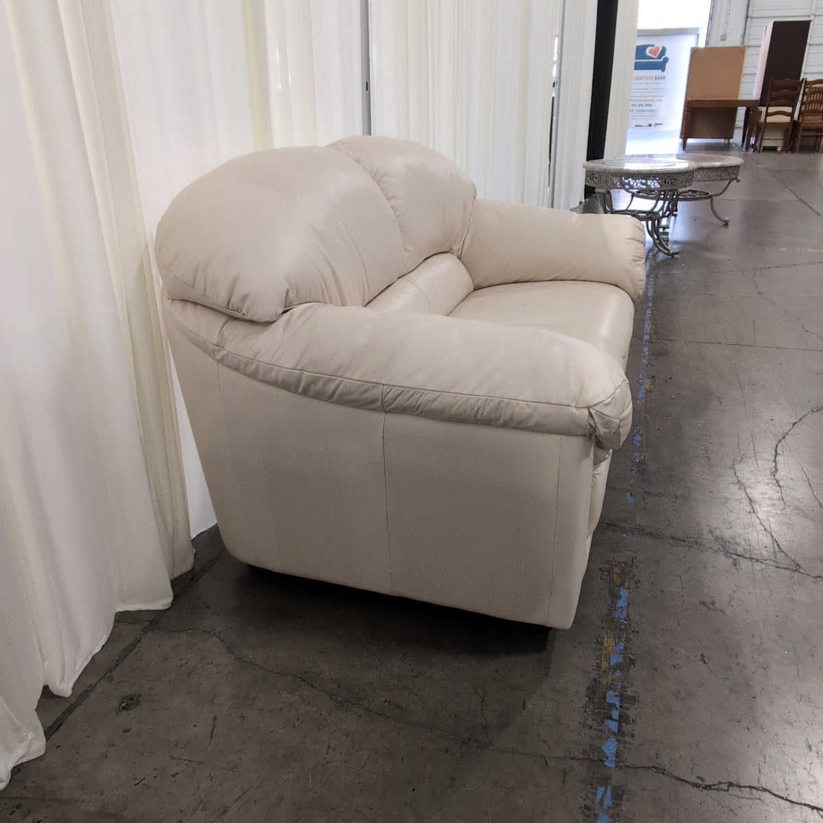 Cream Rolled Arm Loveseat in Leather