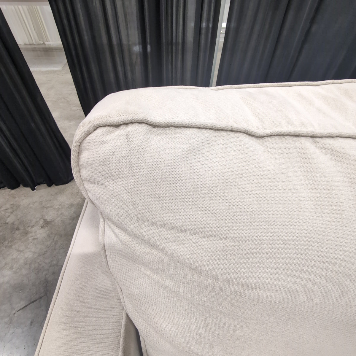 Tan Fabric Three-Seat Reclining Couch with Piped Edges