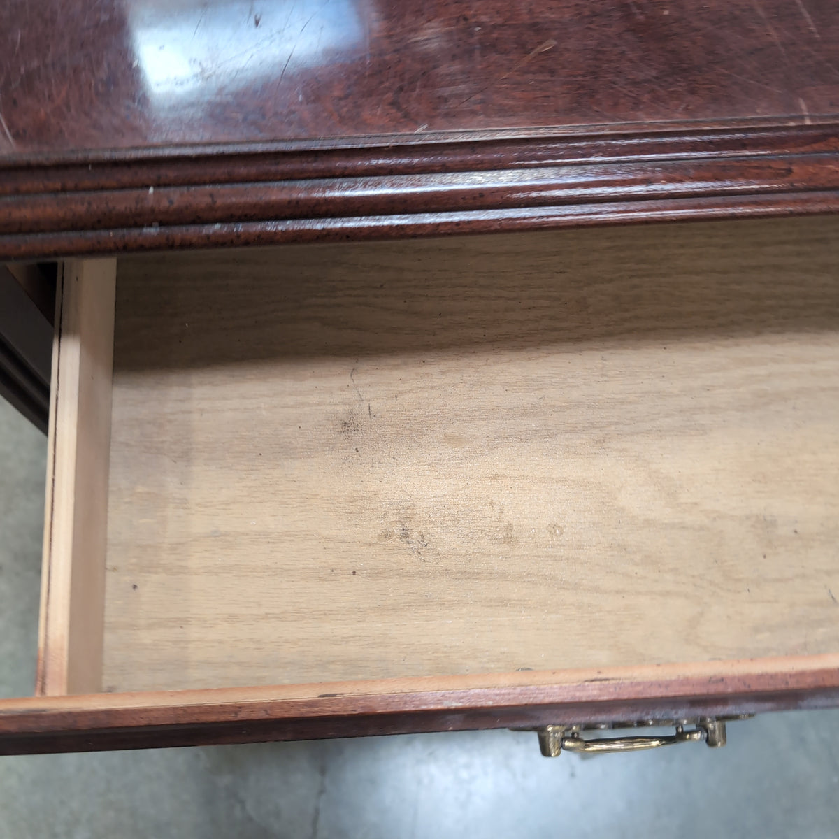 Traditional Dark Wood Three-Drawer Nightstand with Ornate Hardware