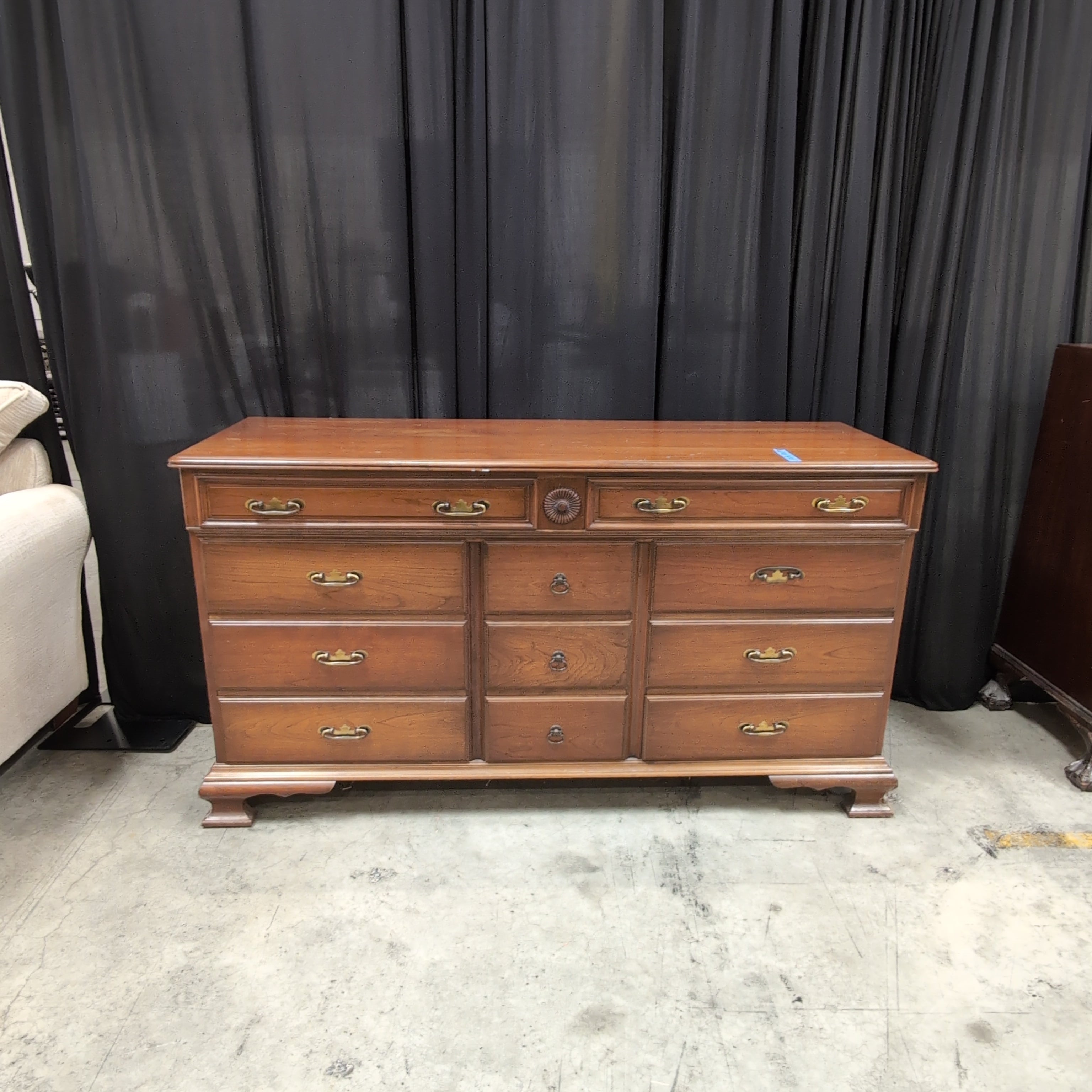 Traditional Brown Wood Dresser with Ornate Hardware