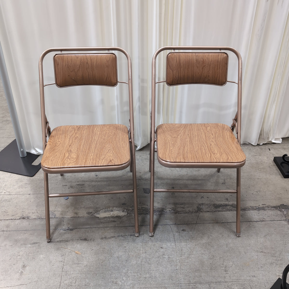 Pair of Bronze Metal Folding Chairs with Wood-Look Seats
