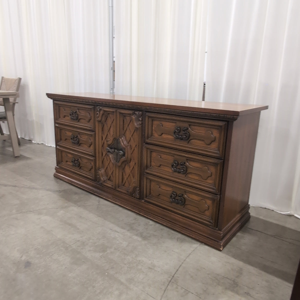 Traditional Brown Wood Dresser with Ornate Hardware