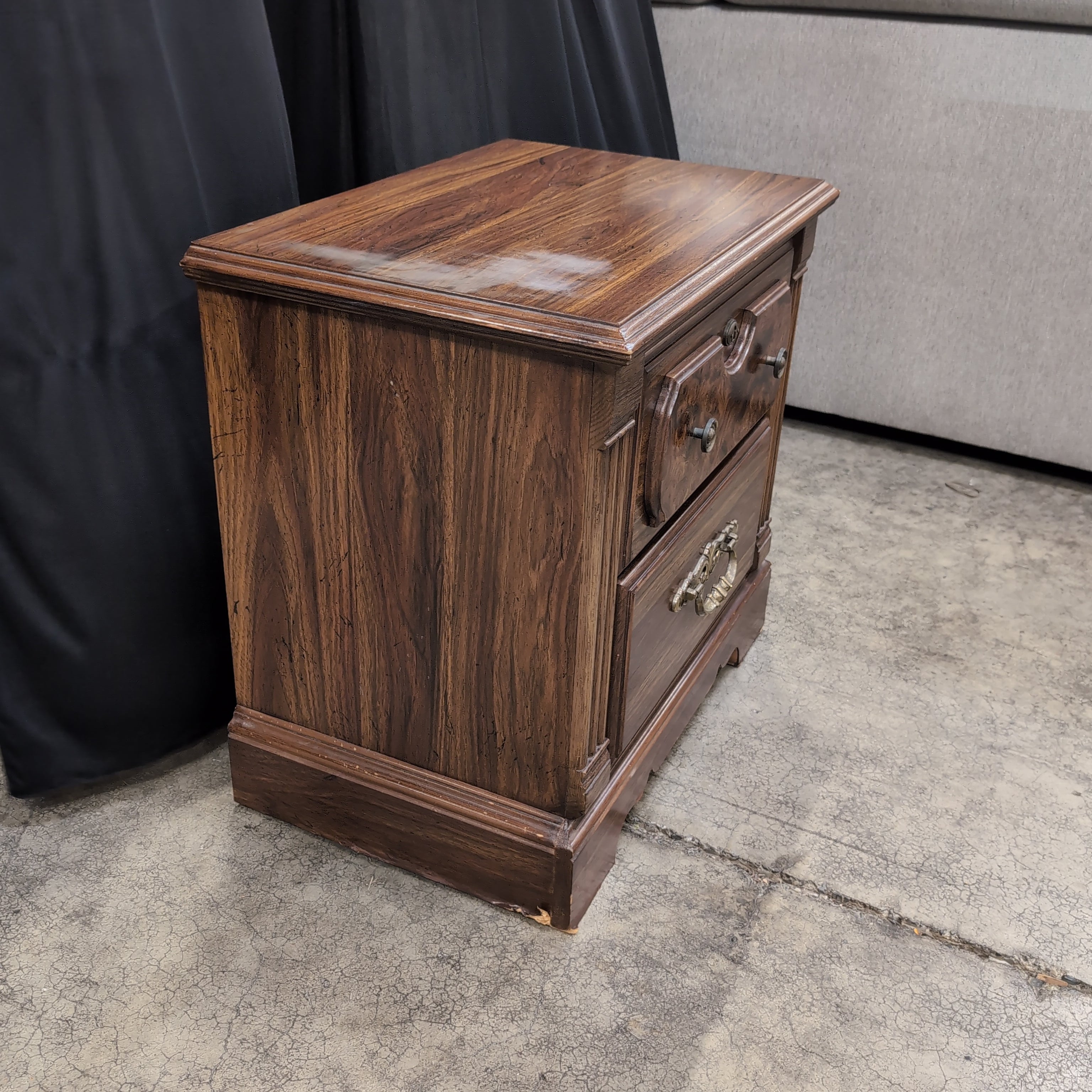 Traditional Dark Wood Two-Drawer Nightstand with Ornate Hardware